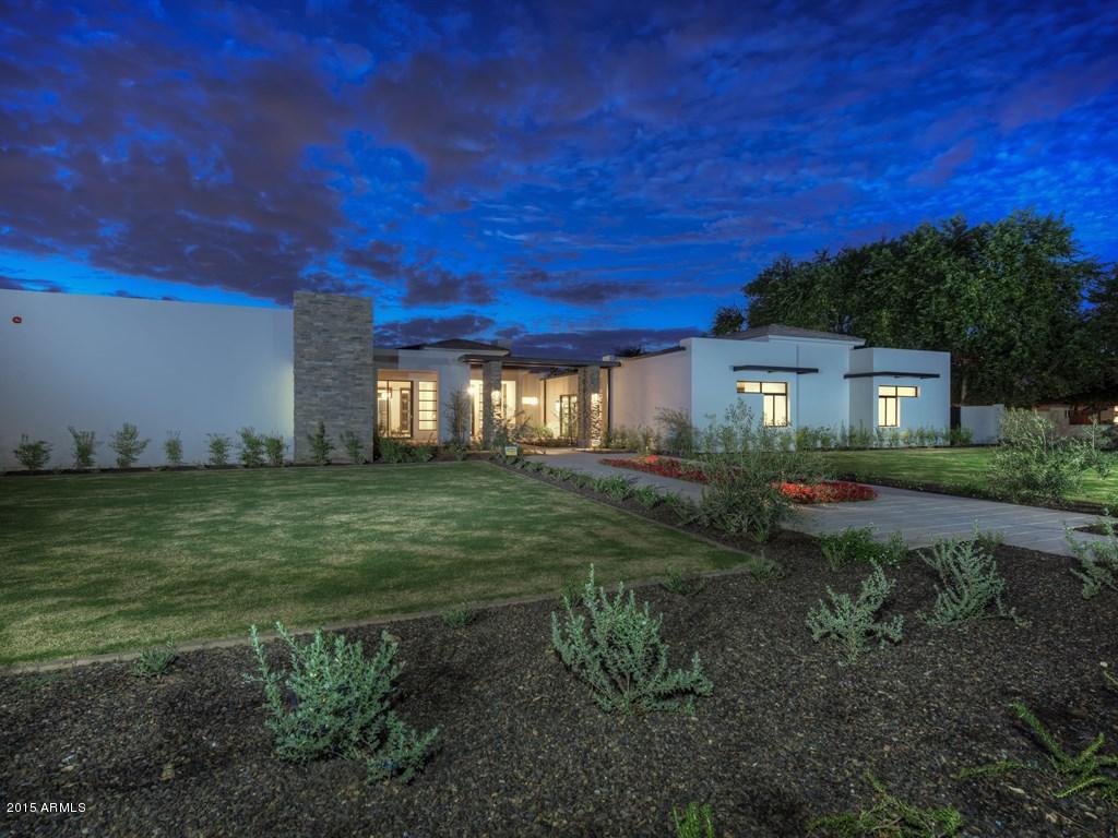 JUST COMPLETED - Northern Lights – A tasteful, modern home, built by Eagle Luxury Properties, located in the highly coveted neighborhood of Paradise Valley Farms. Upon entering the spacious open floor plan you are greeted with the open great room complete with a 30 foot multislide glass wall system that brings the outdoors in. This incredibly well thought out home boasts a large commercial kitchen, chef's pantry and kitchen office, private dining room with butler pantry, breathtaking glass wine cellar & a private office including a full bathroom and closet (or a 6th bedroom).  There is a great lounge area or children’s lounge adjacent to the 3 bedrooms all with en-suite bathroom.  The master retreat offers a large sitting room, spacious bathroom and his & her walk-in closets... JUST COMPLETED - Northern Lights â€“  A tasteful, modern home located in the highly coveted neighborhood of Paradise Valley Farms. Upon entering the spacious open floor plan you are greeted with the open great room complete with 30' multislide glass wall system that brings the outdoors in. This incredibly well thought out home boasts a large commercial kitchen, chef's pantry and kitchen office, private dining room with butler pantry, breathtaking glass wine cellar and a private office including a full bathroom and closet (convertible to another bedroom).  An exquisite lounge area or children's lounge adjacent to the 3 bedrooms all with en-suite bathroom.  The master retreat offers a large sitting room, spacious bathroom and his & her walk-in closets. A perfect fit for a well deserving owner.  A 4 car oversized garage, large covered outdoor patio and formal courtyard at entry are the perfect details to round out this BRAND NEW HOME.
 
The 797 sq ft Guest House includes living room, bathroom and separate bedroom providing ample space for multiple uses ( in-law suite â€“ guest casita â€“ nanny quarters â€“ pool house etc.)
 
Combined the home represents a total of 7182 square feet with a full landscaped property with custom pool and spa. This home offers great views of Camelback Mountain and the central location is ideal.