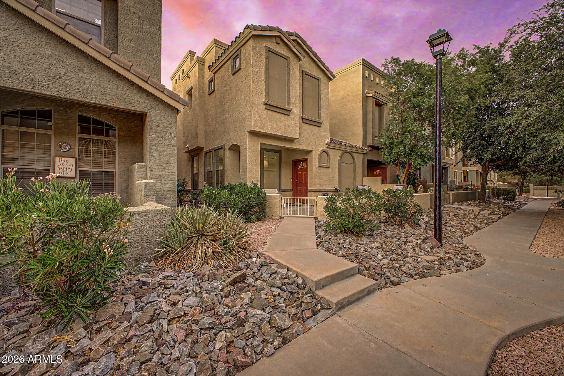 UPDATED END-UNIT TOWNHOME | NEW HVAC + WATER HEATER | CITY LIGHT VIEWS | GATED COMMUNITY

Fully updated 3-bedroom, 2.5-bath townhome in gated Strada with fresh flooring, a renovated kitchen, and a clean, modern aesthetic throughout. The kitchen features white cabinetry, quartz countertops, stainless steel appliances, a breakfast bar, and a walk-in pantry. High ceilings and an open main living area create a bright, functional layout with space to gather and entertain. Upstairs includes a loft, convenient laundry, and three bedrooms, each with a walk-in closet. The spacious primary suite offers a double vanity, full bath, and private toilet room. A private courtyard provides room for outdoor dining, grilling, or a custom seating area. Additional highlights include a new HVAC system, new water heater, dual-pane windows, and a direct-access two-car garage. Enjoy city light views, a heated community pool and spa, playground, and quick access to Loop 202, US 60, shopping, dining, hiking, and Falcon Field.