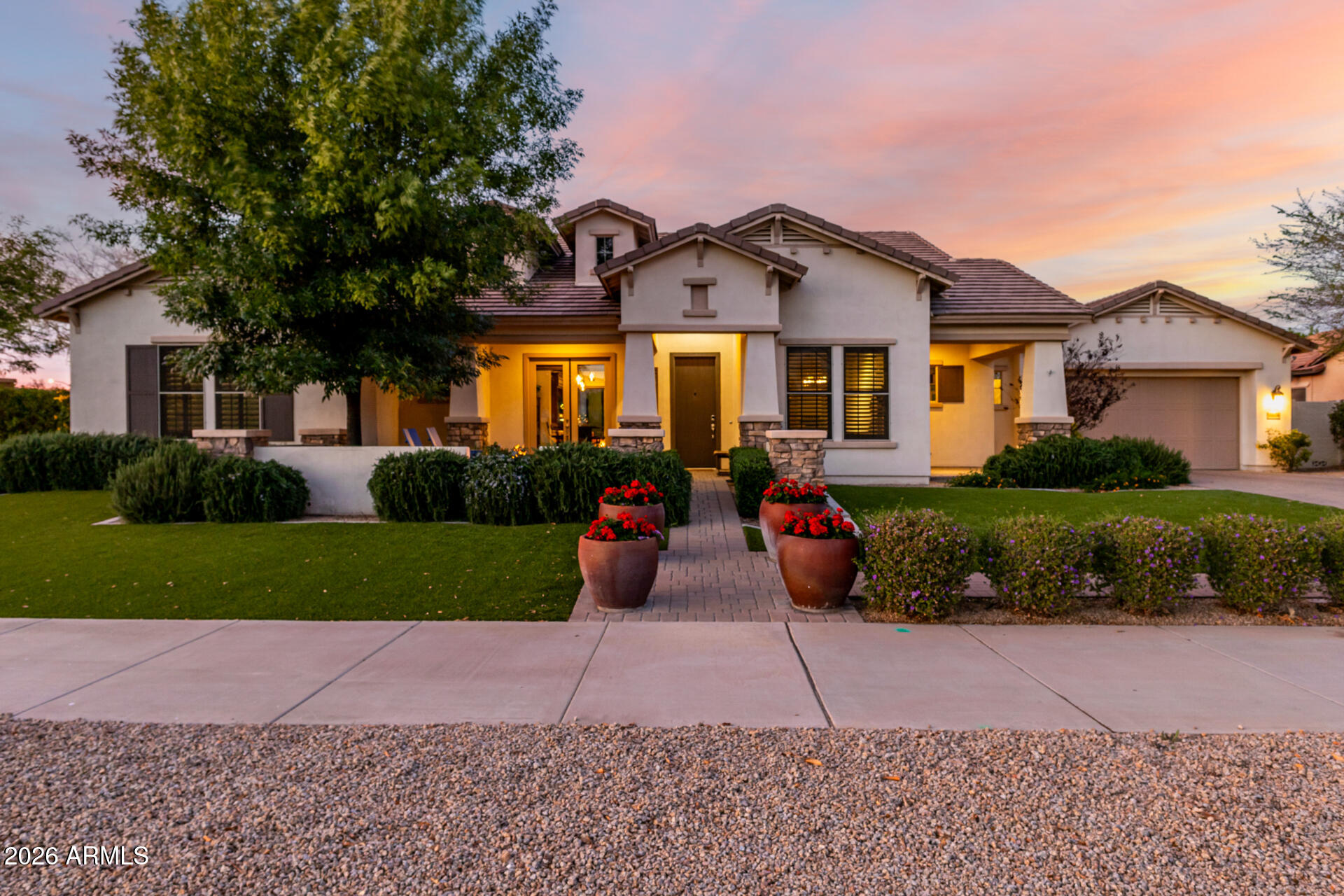 This exquisite residence, in the heart of Litchfield Park embodies quality, function, and timeless design. From the moment you step inside, you're captivated by impeccable custom finishes and thoughtful craftsmanship. Rich hardwood flooring, designer tilework, and an open, airy floor plan create a seamless blend of sophistication and livability,  perfectly suited for both busy family life and elegant entertaining. Expansive living spaces flow effortlessly, while carefully curated details reflect professional design at every turn. Indoor and outdoor living are beautifully intertwined, creating harmonious Arizona living. The large lot is just under 1/2 an acre, with a North-facing backyard, just across the street from the Wigwam Golf Course.  The amazing backyard offers a private retreat, perfect for relaxing evenings, lively gatherings, or simply enjoying the serene surroundings.  Guests will feel truly at home in the tranquil detached casita, complete with its own private patio and firepit, an inviting escape for visitors or multigenerational living.  Located just a bike ride from charming downtown Litchfield, the iconic The Wigwam Resort/Spa/Golf Course, and A++ rated schools, this artfully designed semi-custom home presents a rare opportunity to own a distinctive property in one of the area's most sought-after communities.