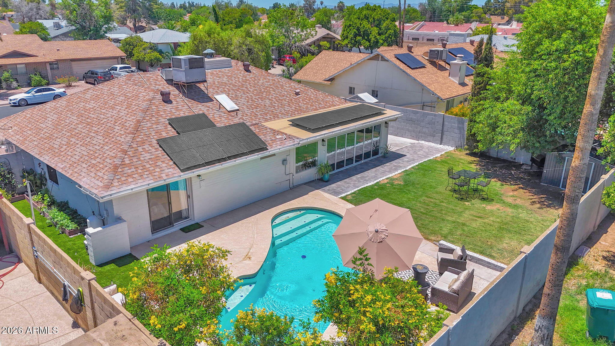 Rare opportunity in Candlelight Estates! Paid-off solar, **NO HOA**, RV gate, oversized lot, sparkling pool, and a stunning 16-foot vanishing glass wall--this is the one you have been waiting for.

Beautifully updated 4-bedroom, 2.5-bath home in highly sought-after Candlelight Estates. Situated on an oversized lot with paid-off solar, RV gate, extended driveway, and no HOA, this move-in-ready property offers everything you're looking for in one of Mesa's most desirable neighborhoods.

Inside, you'll find a fully remodeled kitchen featuring quartz countertops with a waterfall edge, custom cabinetry, beautiful luxury flooring throughout, and a striking two-way fireplace. The showstopper is the dramatic 16-foot vanishing glass wall that opens completely to the new paver patio, creating seamless indoor-outdoor living and an incredible space for entertaining.

The private backyard oasis features a sparkling pool, lush grass, elegant flowering trees, and a thriving herb garden. No detail was overlooked with the thoughtful design and extensive upgrades, including fresh interior and exterior paint, updated lighting and fixtures, a newer roof, and more.

Located within walking distance of top-rated schools, Candlelight Park, and a nearby golf course, with convenient access to shopping, dining, and freeways.


Homes offering this combination of paid-off solar, NO HOA, RV parking, an oversized lot, a pool, and updates rarely become available in Candlelight Estates. Come see why this home stands out from the rest.