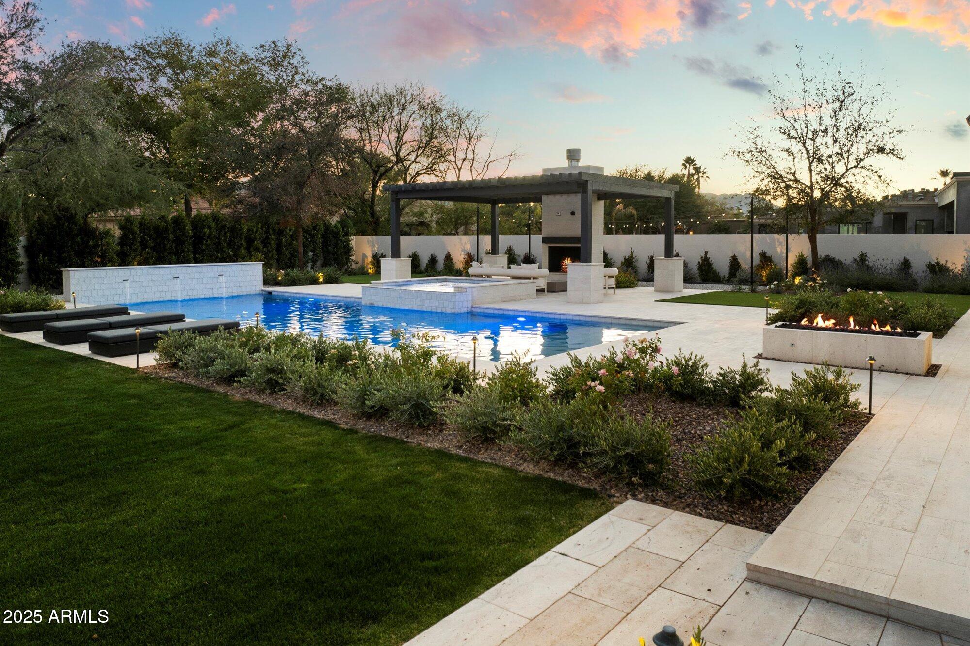 Experience this stately, European inspired family estate with world-class custom finishes in a nice, quiet neighborhood in one of the most affluent towns in the United States; Paradise Valley, Arizona. The gated estate exudes timeless elegance and masterful quality.  5 En-suites plus a separate Guest House, Game Room, Hidden Kid's Playroom, Wood-Paneled Office/ Study, Bar, Stunning Kitchen with Catering Kitchen, and a large Primary Suite with two separate Custom Closets, and a stunning Primary Bathroom. The Gated Motor-court and 4 Car climate controlled Garage can accommodate lifts. The grounds by Refined Gardens are meant for outdoor entertaining with mature landscaping, fountains, meandering walking paths, Sport Court, Outdoor Kitchen, hot tub, pool, fire pit, fireplace, & large yard.