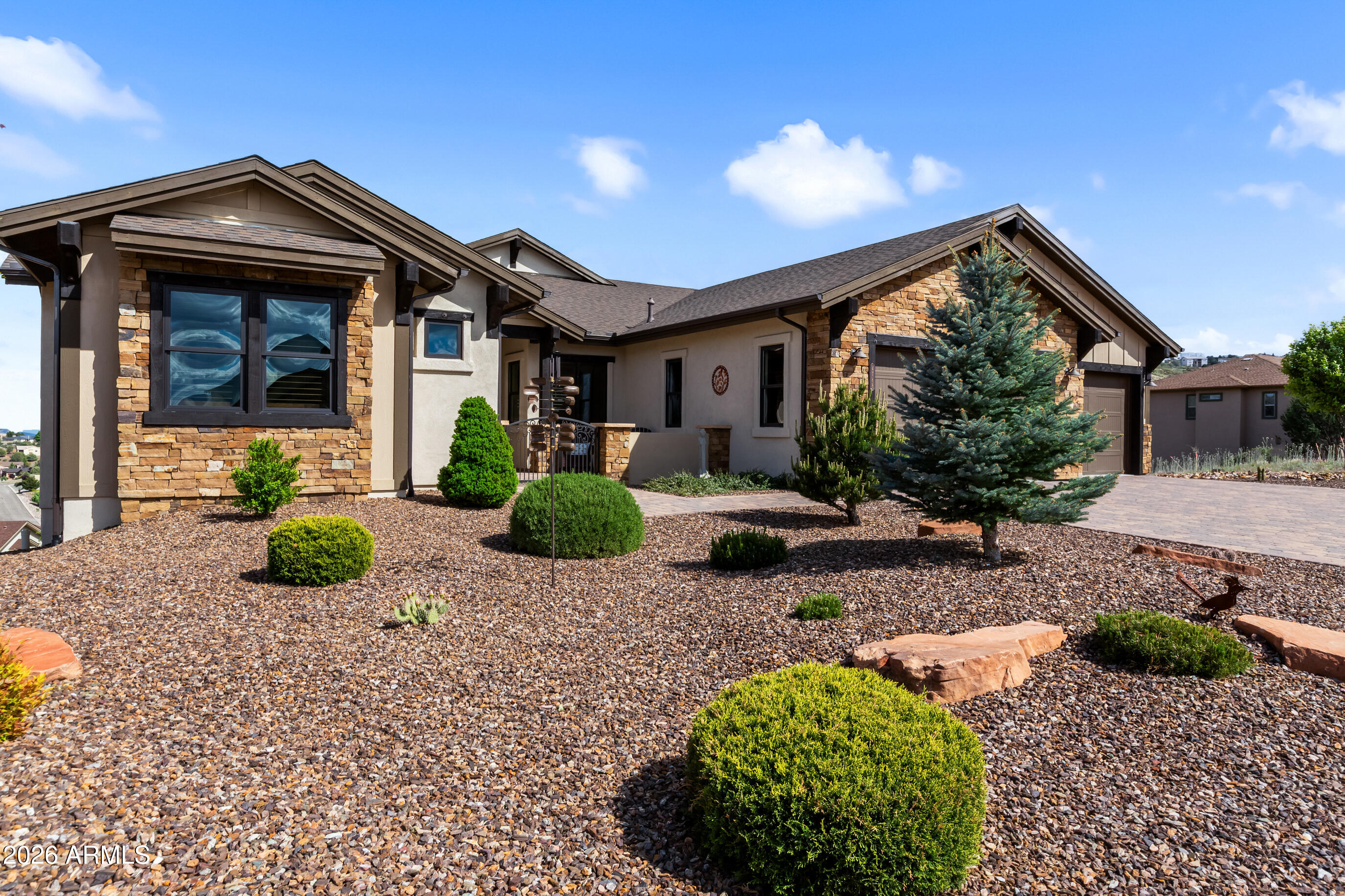 Available Fully Furnished.  Experience luxury living in Yavapai Hills with this stunning 3-bedroom, 2.5-bath,3 car garage, 2857 sqft home at 4788 Sharp Shooter Way, offering breathtaking panoramic mountain and valley views. Featuring high-end wood tile floors, upscale granite countertops, stainless steel appliances, and a cozy gas stone fireplace, this 2018-built property blends modern elegance with comfort. Enjoy a 3-car garage, large back (Trex) deck, and turnkey convenience as it is AVAILABLE COMPLETELY FURNISHED. (Furnishing under separate agreement). The community offers a club house, pool, spa, chldren's playground and pickleball courts. This very special home does not disappoint, bring your toothbrush and start living the high life in Yavapai HIlls.