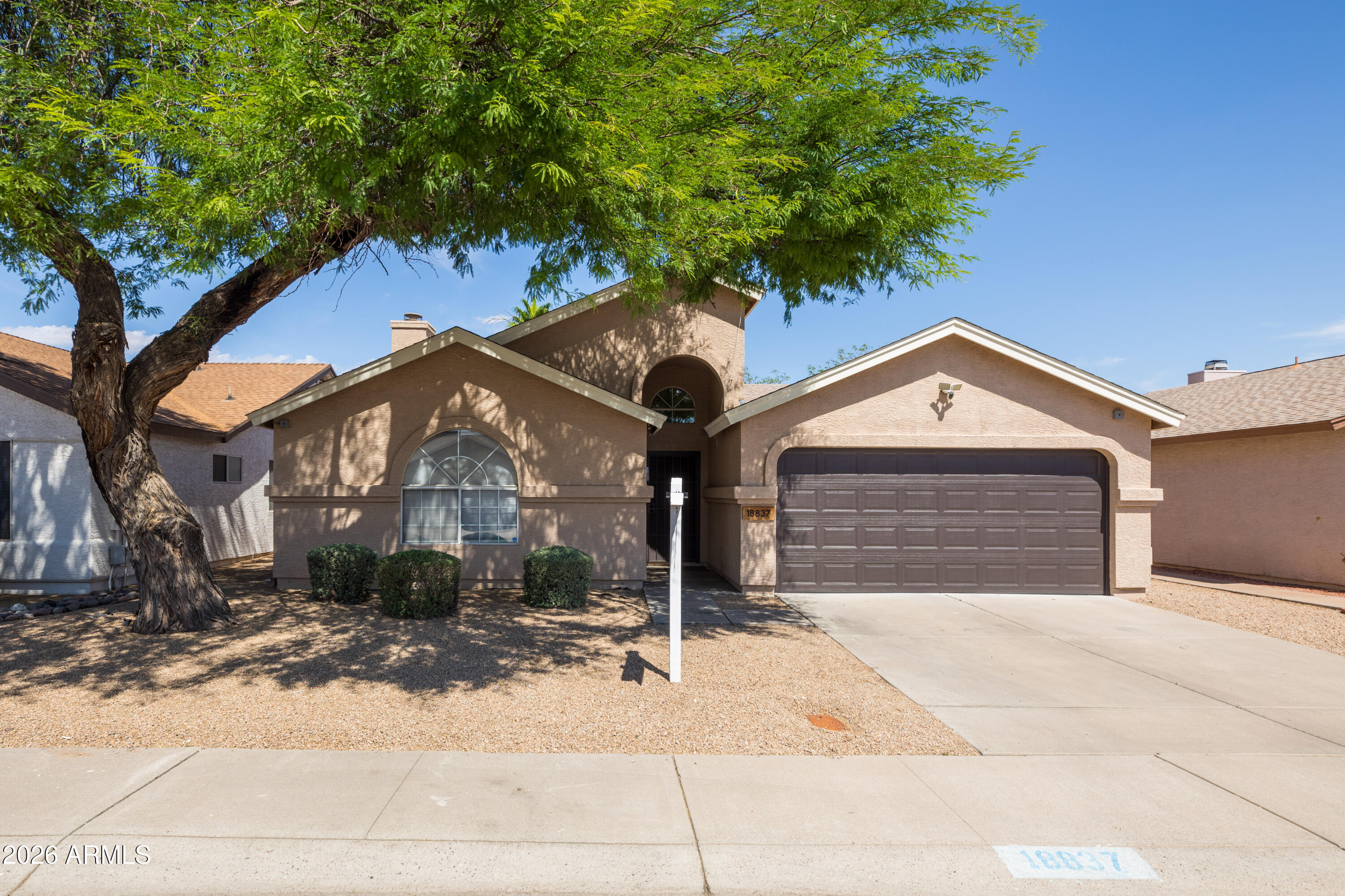 This move-in ready single-family home is located in a highly sought-after area of North Central Phoenix. Featuring a spacious floor plan with a split primary suite and a large, open great room complete with a cozy fireplace. Fresh paint, neutral tile, and elegant finishes--such as marble counters in the kitchen and bathrooms--add to the modern appeal. The HVAC system was replaced in June 2025, and the home is prewired for a smart setup, including speakers and lighting switches throughout. The east facing backyard is perfect for entertaining, with an oversized covered patio, misters, pavers, and low-maintenance artificial turf to help keep water bills down. Enjoy the freedom of no HOA! Hiking trail in the natural desert just around the corner, PV schools, and easy access to the 101.