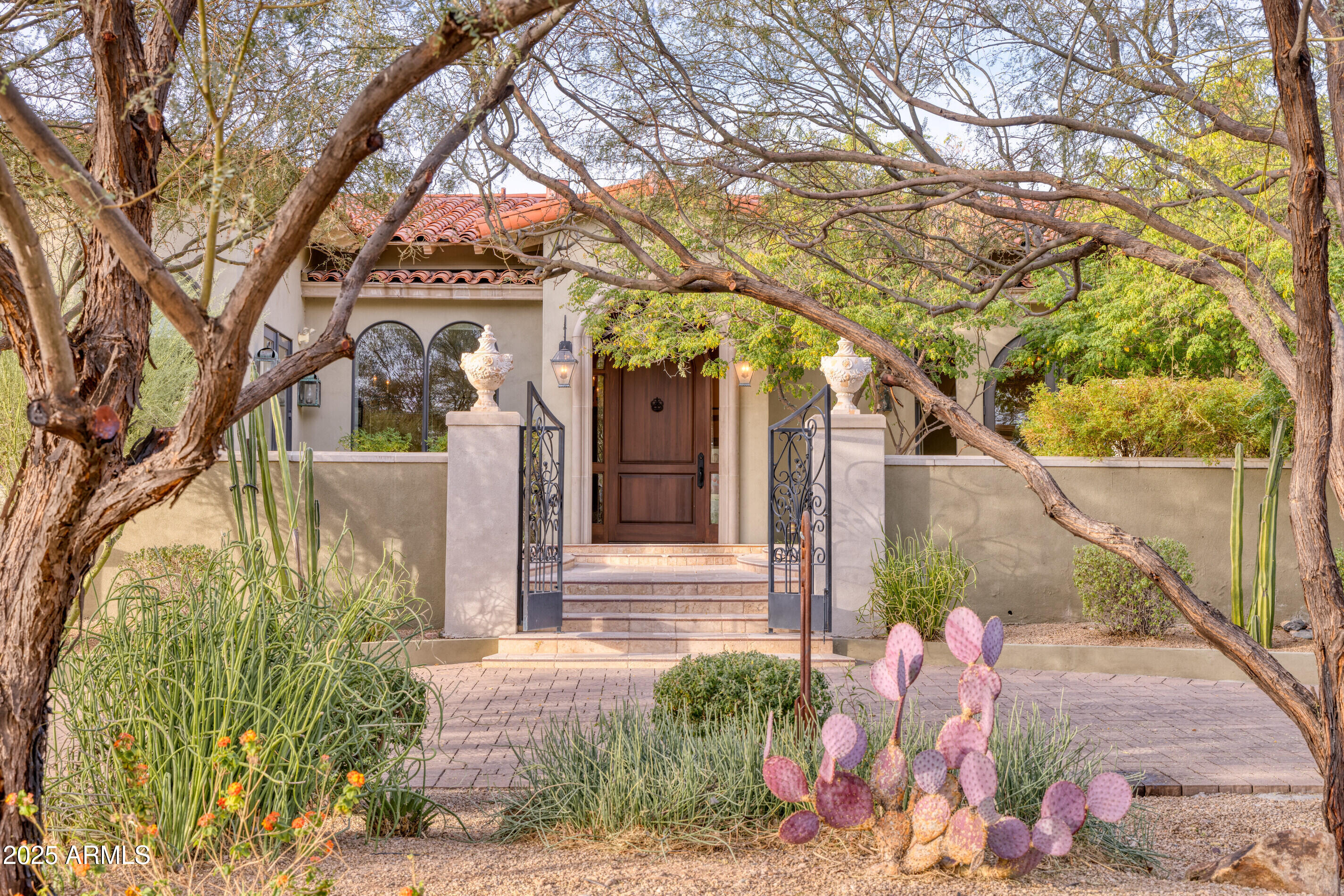 Located in Guard-Gated Clearwater Hills, within walking distance of PV Country Club, this Santa Barbara home offers possibilities to update, renovate, or build anew on a coveted lot. A circular drive leads to welcoming front patio w/fireplace. High ceilings, stone fireplaces, crown molding, and French doors are featured throughout. Large gourmet kitchen boasts Viking appliances, large granite island, and windowed breakfast room. The primary suite includes sitting room, dual closets, + luxurious white marble spa-like bath. A 2nd bedroom w/fireplace and private bath offers potential as 2nd primary suite. The library features custom woodwork and French doors. Entertain guests around large pool, built-in BBQ w/sink, fireplace, + large covered patio. This great lot offers tremendous potential