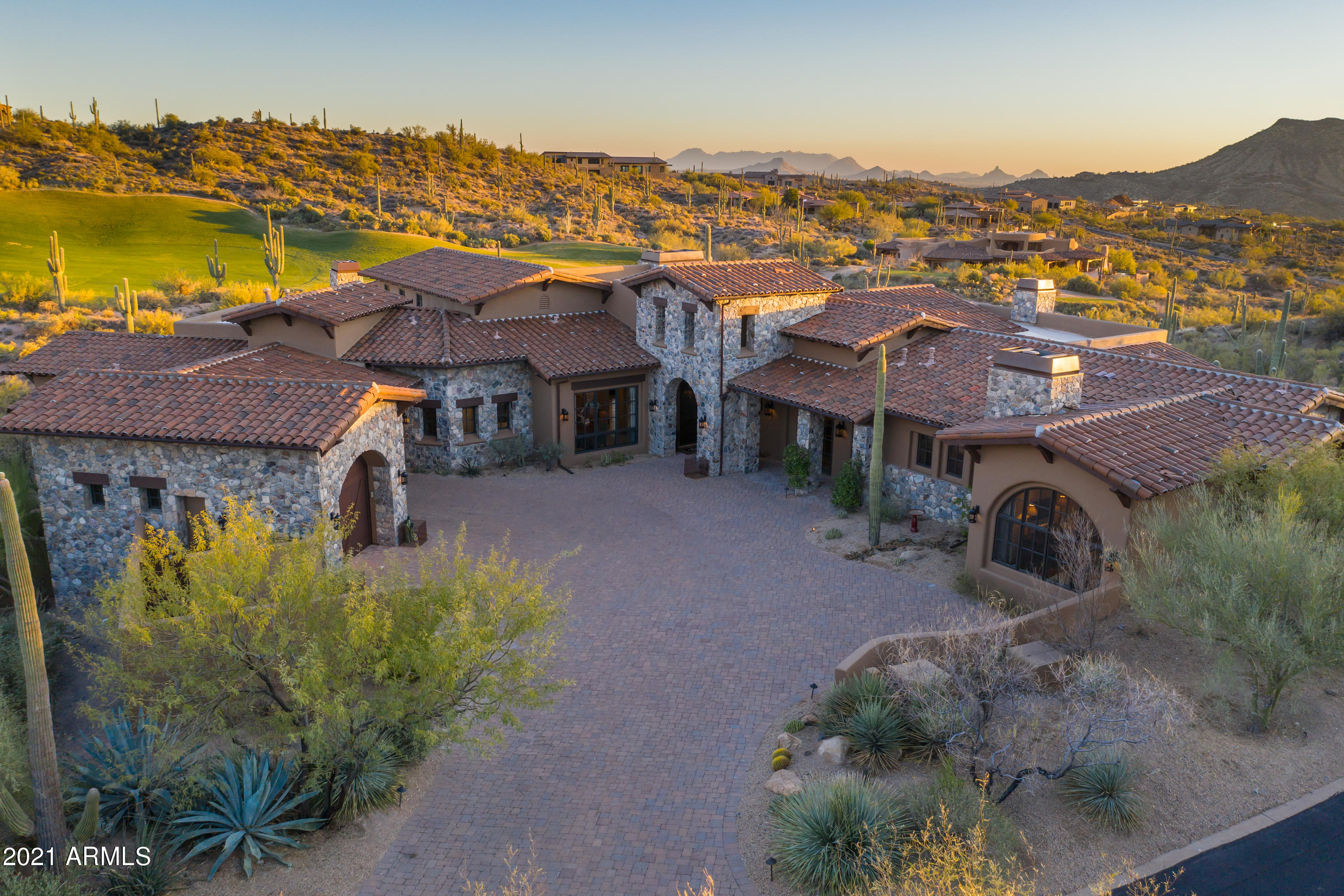 This 6,254 sq ft fully furnished open Tuscan style home features 5 bedrooms (3 in main house), 5 baths + 2 half baths (powder and pool bath), separate office plus a 2 bedroom casita with living room & kitchenette. Situated on 2+ acres high above the 16th fairway of The Chiricahua golf course in Desert Mountain with spectacular south/southwest sunsets,golf course, city lights & mountain views! Open great room with retractable Bi-Fold glass doors surrounding a large Canterra Stone fireplace! Spacious master with 2 sitting areas and fireplace! Finest  materials including Venetian Plastered walls, hand hewn beams, Large Versaige pattern travertine floors and custom cabinetry w/ plenty of storage. Gourmet kitchen w/ Wolf & Sub Zero appliances, extended kitchen island, breakfast area and family room with fireplace! Bi folding windows above kitchen countertops for indoor/outdoor living and seating & large walk in pantry. Retractable glass doors showcasing breathtaking views. The expansive outdoor patio and living spaces features total privacy and a custom shaped negative edge pool and spa. Outdoor fireplace, heat lamps, BBQ, and pizza oven. Large motor court leads into an oversized 3 car garage. Desert Mountain features 7 golf courses, 6 clubhouses, private hiking trails, fitness center, multiple pools and spa. Membership available but not included.