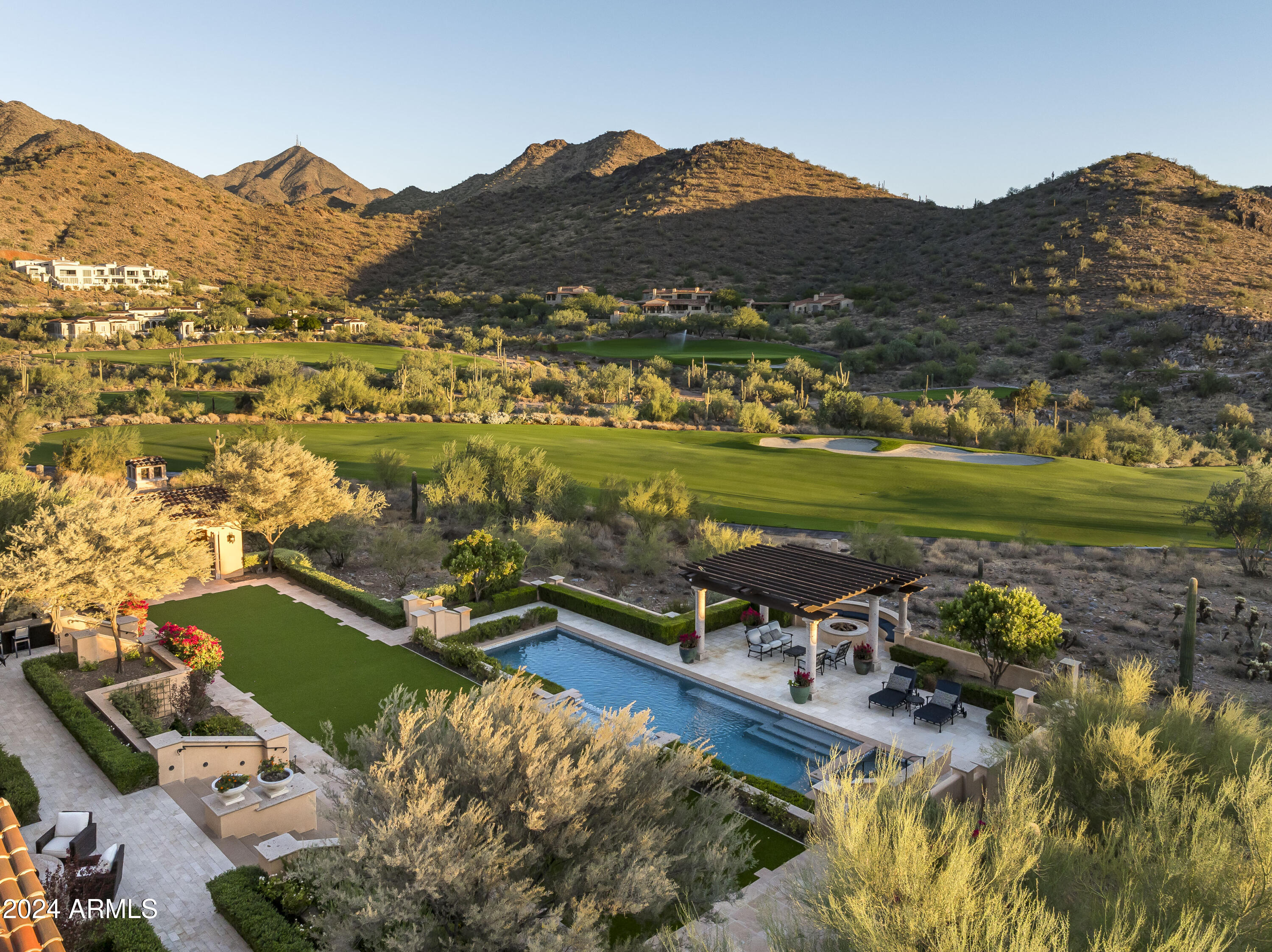Prime golf course frontage in prestigious Silverleaf!  FULL GOLF MEMBERSHIP is available via separate purchase, allowing a buyer to bypass the lengthy wait-list.  This exceptional 9,154 sq. ft. single-level, Spanish Colonial home, is ideally situated on over 2.1 acres backing to the 17th fairway.  Designed by acclaimed architect Erik Peterson and built by Salcito Custom Homes in 2013, this south-facing residence offers sweeping panoramas of multiple golf holes, the Silverleaf clubhouse, the McDowell Mountains, Camelback Mountain, and distant city lights. The property's desirable location is just blocks from the Clubhouse and Horseshoe Canyon guard gate, providing convenience and exclusivity. The thoughtfully designed floor plan features a luxurious master wing with an oversized primary suite and two separate private offices. The entry leads to a spacious living room with a full bar and wine room, while the open kitchen and family room are complemented by a dedicated prep area and pantry. Additional highlights include a dedicate home theatre, private guest wing with two ensuite bedrooms, an exercise room, and a separate entry guest casita. The arrival area boasts ample guest parking and a generous auto court leading to a 5+ car garage. Elegant interior finishes showcase reclaimed wood flooring, Wolf /Sub-Zero appliances, whole-home Savant automation, wood beam ceilings, and designer light fixtures. The meticulously landscaped outdoor spaces provide numerous opportunities to enjoy Arizona's desirable climate. In addition to two private courtyards, the expansive backyard features a 20-meter pool and spa, a large covered patio, a separate cabana, BBQ center, large turf area, multiple fountains and fire features, and a trellis sitting area that captures panoramic views. This is an extremely rare find: a single-level home on the golf course in Silverleaf, complete with immediate golf membership opportunity. Silverleaf is renowned for its timeless architecture, world-class golf and spa facilities, and proximity to hiking, biking, dining, shopping, the Scottsdale Airport, and the Loop 101. Contact us for more information and secure your place in this distinguished community.
