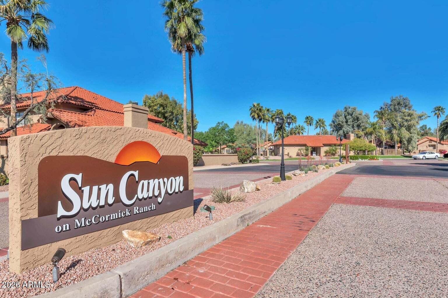 Property is in McCormick Ranch townhome. The courtyard entrance leads you into the comfortable Great Room with cozy fireplace. Entertaining is a joy with a generous dining area and gorgeous kitchen featuring European cherry hardwood cabinetry with built-ins/pull outs & rich slab granite counters with marble back splash and flooring. Enjoy the desert air on your tile patio with storage. Two spacious bedrooms with updated baths. Crown molding; Upgraded carpet & tile throughout. One car garage. Community has heated pool, spa, community center with fitness area, green areas, walking paths, restaurants, shopping and more.