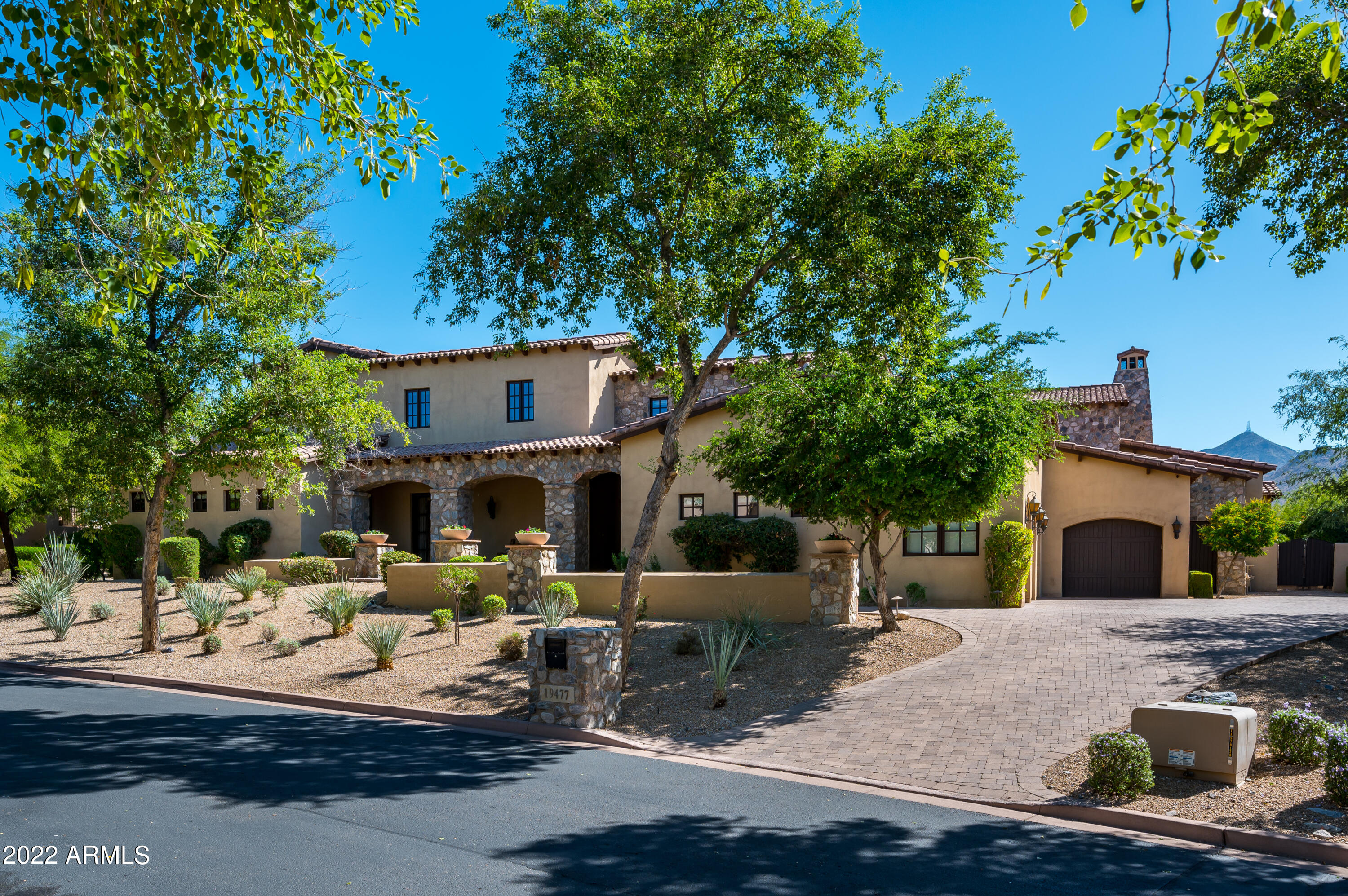 Updated Rural Mediterranean home in the Arcadia neighborhood at Silverleaf.  A charming center courtyard greets you as you enter and provides light and ambiance to the interior spaces.  This 6,572 square foot home features an open great room plan, split master suite, and all but one bedroom on the main level.  This plan also includes a game room, office, and exercise room.   Beautiful interior finishes include stone and wood flooring in main areas and dramatic wood beams in great room and master suite. The best of Arizona outdoor living in multiple spaces include courtyard, BBQ cabana, spa trellis area, covered patio, and sunny deck by the pool. Offering upgraded finishes, numerous outdoor gathering places, mountain views and curb appeal on a quiet cul-de-sac location, making this the pe