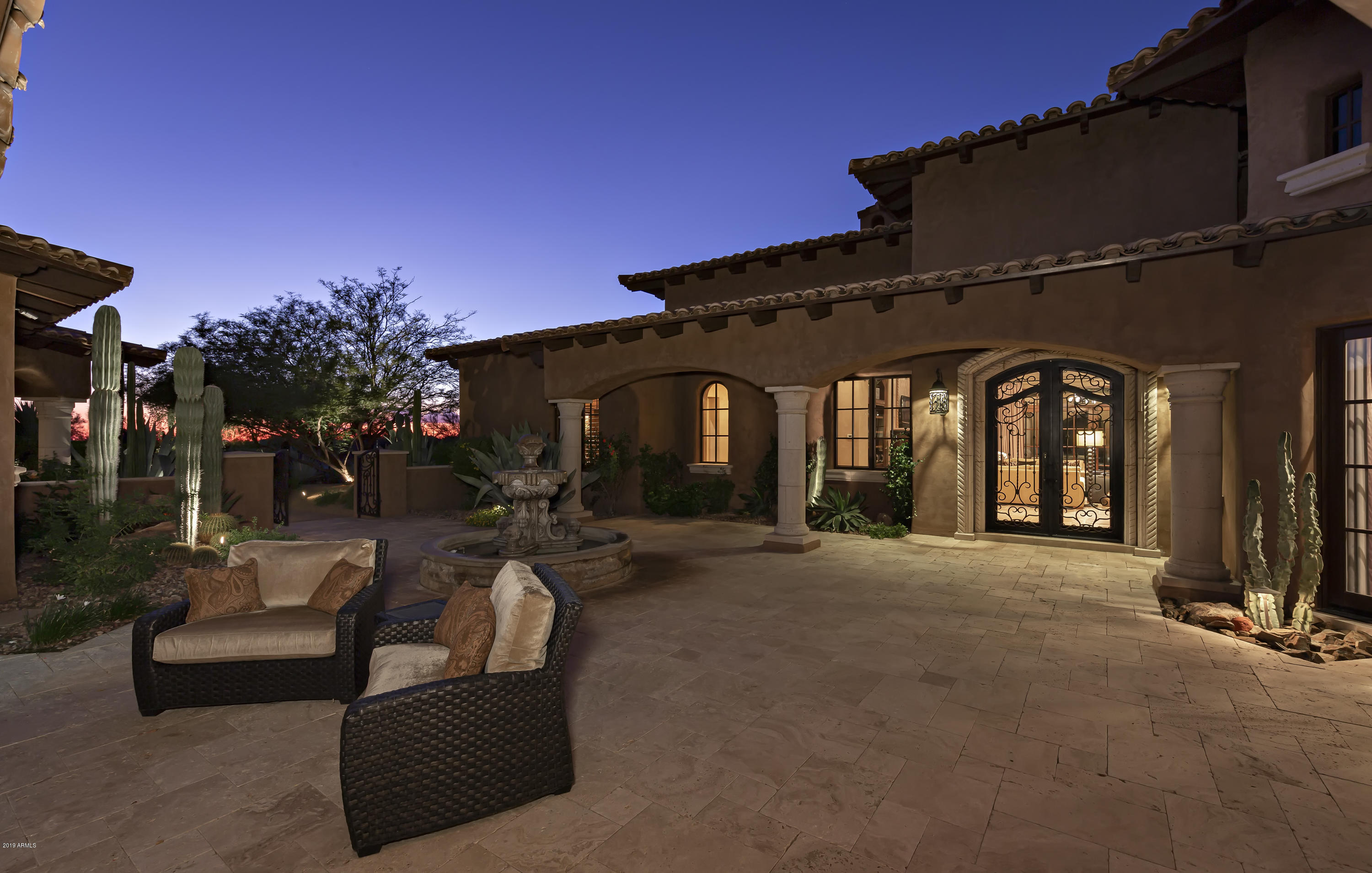 Mediterranean-inspired custom home situated on a 1.6 acre site, located within the guard-gated community of Whisper Rock Estates * Thoughtful design and unsurpassed quality throughout * True great room floor plan with kitchen open to living, dining (both casual & formal) and bar spaces for seamless living/entertaining * Master retreat is split and offers a one-of-a-kind wood paneled office, suite with breakfast bar, sitting area w/ fireplace, his/hers closets w/ laundry, and steam shower * No interior steps in the home * Dedicated media room off main living space * Wood plank & natural stone floors, Crestron home-automation, Venetian plaster, custom ceiling details (beams, groin vault and coffered construction), custom fireplace surrounds and temp-controlled wine room * 2 additional suites in the main house * 2-room guest house with kitchenette and bedroom suite * 2, 2-car air-conditioned garages * Mature landscape, generous covered patios (with auto-sun shades), multiple fireplaces, built-in BBQ center and heated pool & spa complete the residence *