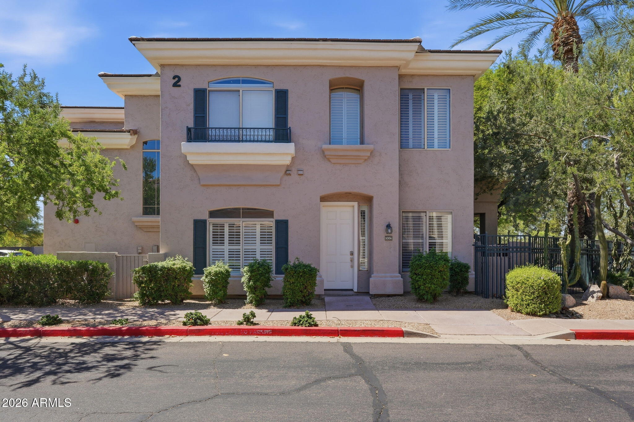 One of only 2 units in this gated community with direct patio access to the pool, spa & BBQ area. This 2 bed/2 bath split floor plan features high ceilings, no interior steps & a great layout. Kitchen includes walk-in pantry, breakfast bar & all appliances. Great room offers a gas fireplace, dining area & surround sound wiring. Primary suite has a sitting area, walk-in closet & dual sinks. Second bedroom includes a Murphy bed ideal for guests or a home office. Entire unit fit with shutters. One-car garage with direct access & separate laundry room with storage.