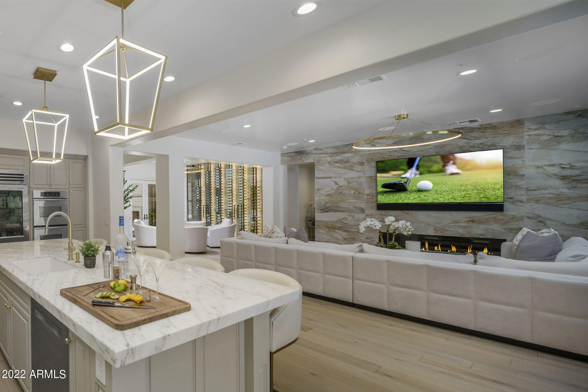Exquisitely remodeled 5 bedrooms, 4 bathrooms, 3 car garage home in gated DC Ranch community! Designed and built by Camelot Homes, this prestigious N. Scottsdale home features an open concept floor plan, upgraded cabinetry, premium marble counter tops, designer lighting and plumbing fixtures, Control4 system, wine cellar, office/ den, generous living spaces, side courtyard, and a luxe resort-style backyard.  Overlooking the main living areas, the home's well-appointed kitchen boasts a top-of-the line Sub-Zero stainless steel preservation system; multiple ovens, Bosch dishwasher, over-sized marble kitchen island, butler's pantry, and wet bar. The primary bedroom suite features a luxurious primary bath, Carrara marble flooring, dual marble vanities, soaking tub, and spacious walk-in closet. Resort-style backyard is highlighted by breathtaking sunset views, heated pool with Baja step, tiled spa and water features, poolside seating area, outdoor living/ dining on back patio; porcelain tile pavers, mature landscape, and artificial turf grass play area. This is one of the most exceptional properties available on the luxury market!