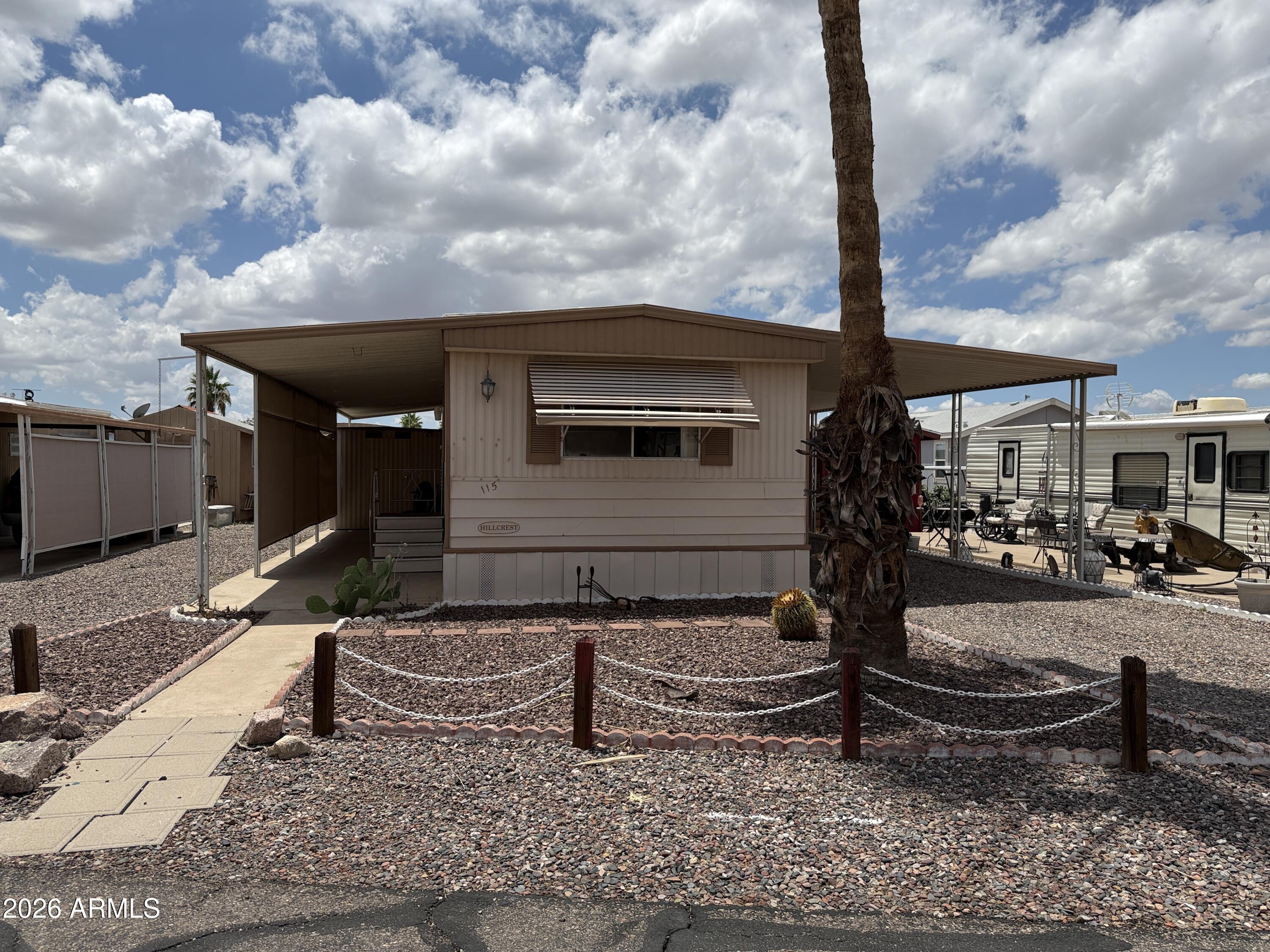 Furnished 1 bed, 1 bath 1978 Skyline Hillcrest (14x52, 728 sq ft) with bonus workshop/storage in the 55+ Paradise community. Bright living room with large windows, dine-in kitchen with breakfast bar and curio cabinet. Appliances include electric stove, fridge, microwave, washer/dryer. Spacious bedroom with double closet and direct bath access. Central heat & A/C, easy-care desert landscaping, large lot. Community offers clubhouse, pool/spa, fitness center, library, and seasonal activities. Pet-friendly (2 max, breed restrictions). Close to I-60, shopping, dining, lakes, and trails.