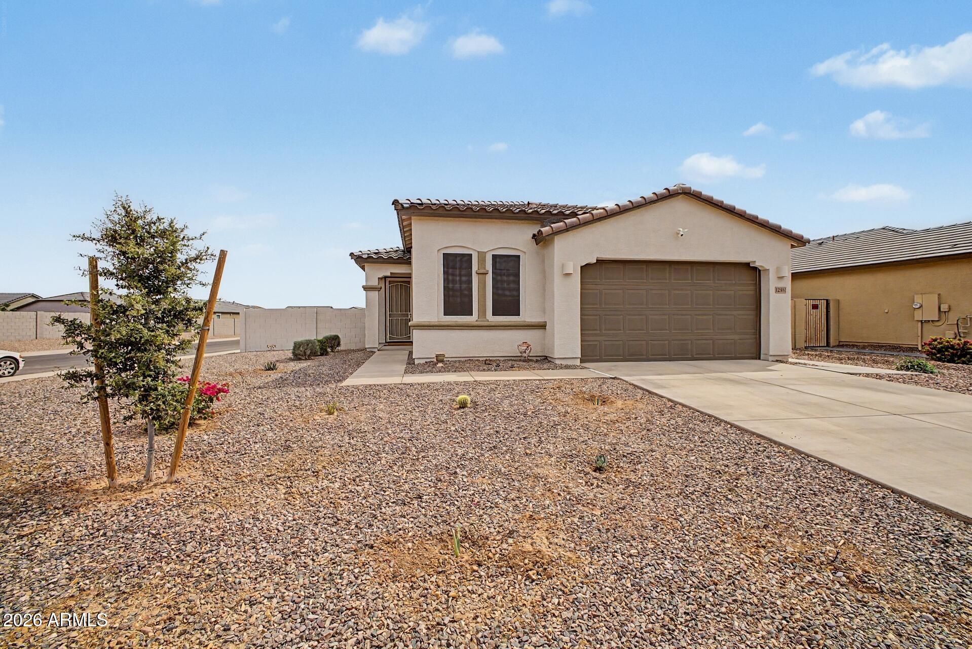 Discover your new home in Florence, Arizona! This beautifully maintained 4-bedroom, 2-bath home offers approximately 1,800 square feet of comfortable living space on a premium corner lot. Inside, you'll find a warm and inviting open layout perfect for everyday living and entertaining. The kitchen features white cabinetry, quartz countertops, stainless steel appliances, and plenty of space to gather. Spacious bedrooms and stylish, functional bathrooms provide comfort for the whole family.

Step outside to a beautifully designed backyard with endless possibilities for relaxing, gardening, entertaining, or creating your own private outdoor oasis. Plus, enjoy upgraded features and thoughtful touches you won't typically find in a new build. Located in a highly desirable master-planned community filled with resort-style amenities, residents enjoy access to a stunning clubhouse with fitness studio, sparkling community pools, kiddie splash pad, playgrounds, ramadas with fire pits, and more -- offering the perfect blend of relaxation, recreation, and community living just steps from your front door.