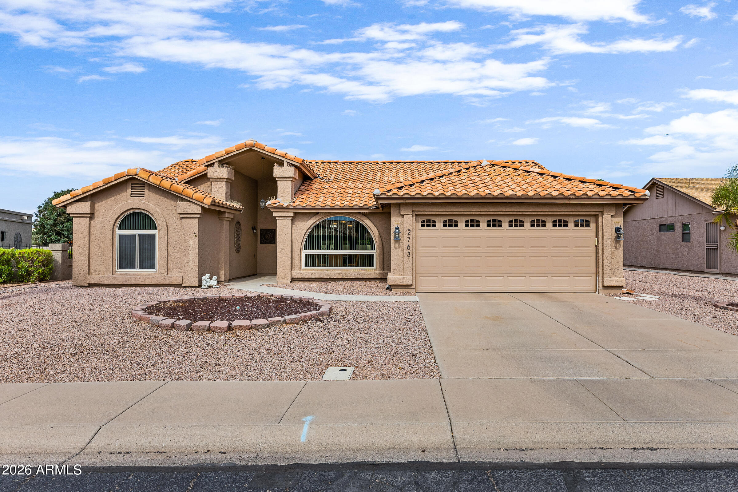 Experience resort-style living in the award-winning, guard-gated community of Leisure World! This beautifully maintained 3-bedroom, 2-bath home offers over 2,100 square feet of light-filled living space with vaulted ceilings, a spacious split floor plan, and thoughtful updates throughout. The kitchen features granite countertops, abundant cabinetry, and a sunny breakfast nook, while the open living and dining areas are perfect for entertaining. Relax in your private backyard with a heated spa or enjoy Leisure World's exceptional amenities, including two golf courses, pickleball, tennis, pools, fitness centers, walking paths, and countless social activities. Arizona retirement living at its finest!
