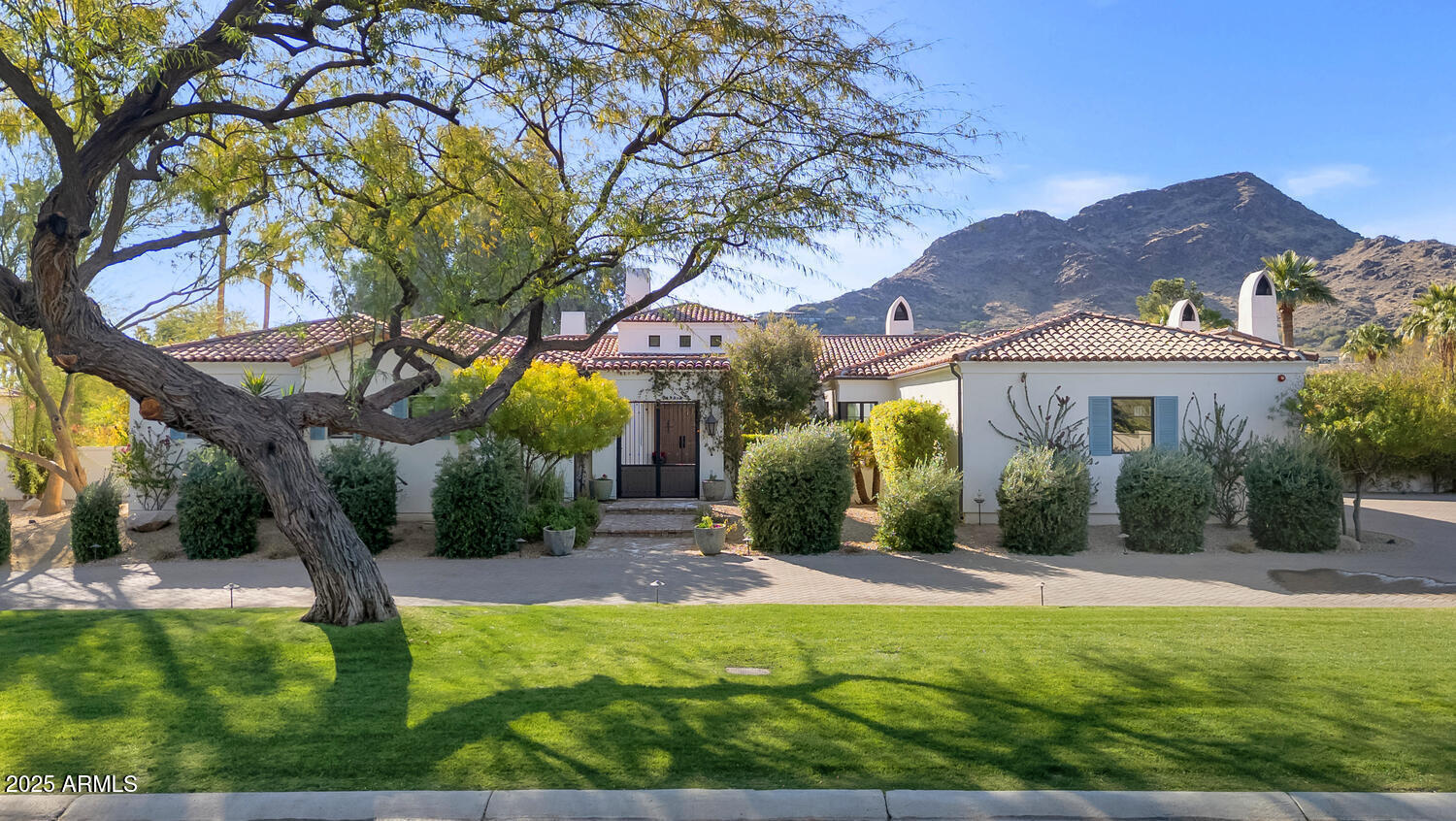 This beautiful Paradise Valley estate is truly something special. From the moment you arrive, you'll be struck by the authentic southwest style that oozes warmth and character. The kitchen is spectacular with double islands, one for dining and the other topped with butcher block is the perfect spot for meal prep. There are formal and informal dining rooms, both with plenty of room to seat huge gatherings, the great room is gorgeous with a unique fireplace serving as a phenomenal focal point, and the private office will make working from home the preference as it's perfectly designed for two people to share. All the ensuite bedrooms are fantastic, including a resort like primary suite with a fireplace and stunning bath, and there's a huge kids living room surrounded by the (see more) secondary bedrooms that's an amazing space to be used as a playroom or teen lounge. Sitting on more than an acre of prime Paradise Valley land, the grounds are exquisite and feature exceptional outdoor living spaces highlighted by the sparkling pool and outstanding mountain views. This home was featured in Phoenix Home and Garden, and it doesn't take long to understand why. It's as impressive as it is comfortable and as elegant as it is family oriented. it's truly a showpiece that any lucky owner would be proud to call home!