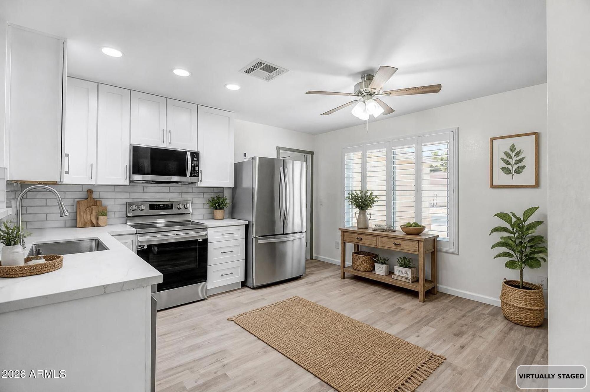 The sellers have invested an estimated $138,250 into this home, with every major system and finish updated in 2025. With a full price offer, they'll also pay off the solar system in full at closing, so you own it outright from day one.

New exterior paint July 2026. The kitchen was fully remodeled with new cabinetry, quartz counters, and LG appliances. New flooring and fresh paint run throughout, plantation shutters dress every window, and the bath and laundry both got added cabinetry with a folding counter. The roof carries a warranty through 2032, the hot water heater through 2034, and the garage features a coated floor, new opener, and new entry door. Both yards were redesigned for easy upkeep, complete with a raised block wall, fresh concrete, a Tuff Shed, and a covered patio pre-wired for fans and lights. A rare one car garage plus dedicated RV parking, no HOA  round it out.
Close to parks, shopping, and schools, with easy access to Surprise, Sun City, and the West Valley. We'd love to walk you through it.