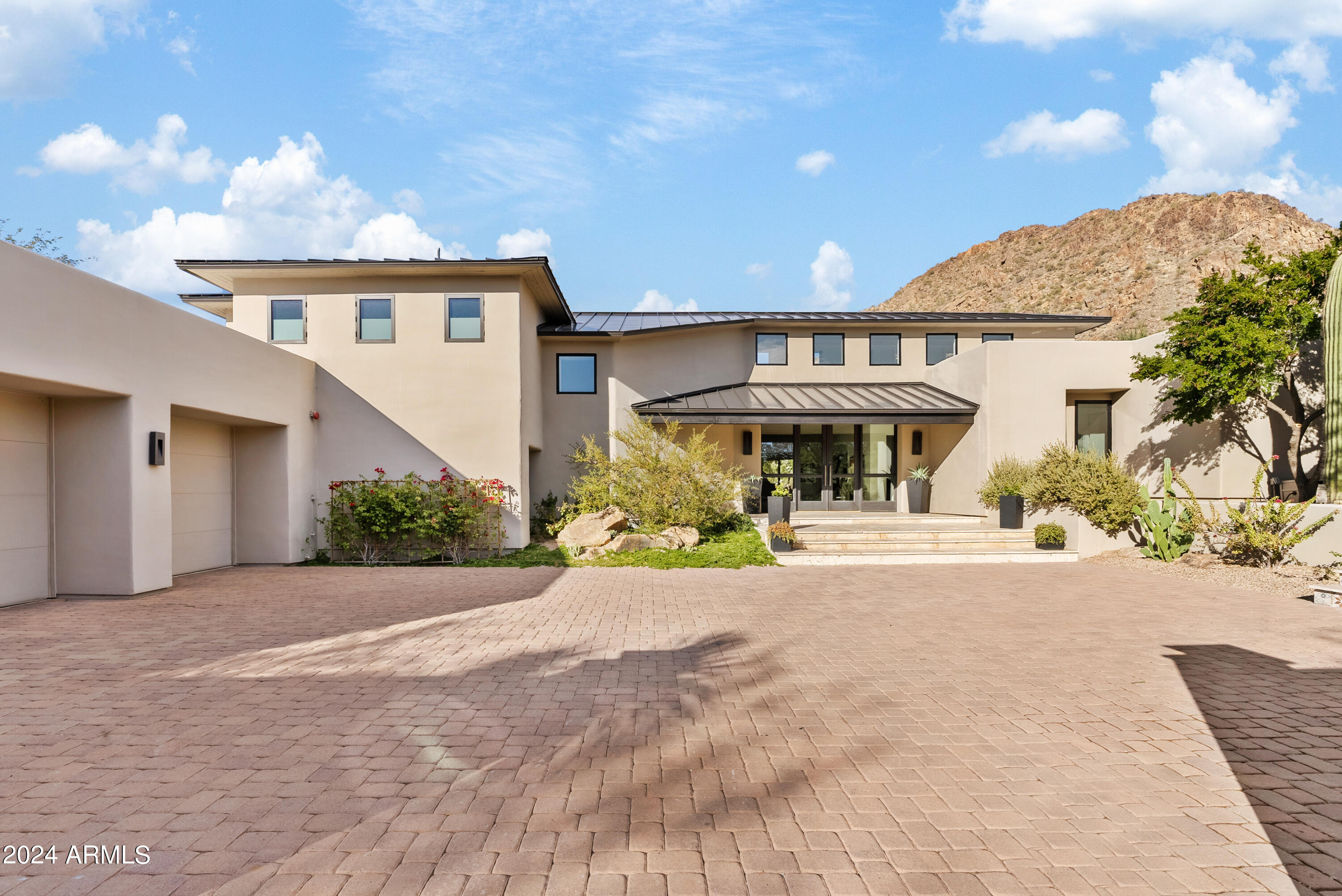 We are now offering exclusive tours of a newly renovated desert contemporary home set in the highly desirable Desert Highlands community honored by Forbes as one of the Top 20 golf and country clubs in the U.S.  You will awaken to the majesty of mountain silhouettes and manicured vistas of the second fairway. Here, each sunset cascades over the property, painting the skies with an array of colors only Arizona can provide. Designed for immediate occupancy, this home is complete with numerous modern luxury touches. Each window showcases views of rugged mountains, sprawling greens, abundant cacti, and the inviting pool and spa, creating a private environment for outdoor living.  With design elements chosen with the utmost care, from the pampering pet spa to the serene guest house, this home is truly an investment in excellence. Members enjoy immediate (no waitlist) access to the Jack Nicklaus Signature golf course, the Gary Panks designed 18-hole putting course, exquisite clubhouse with both casual and fine dining, 7,700 square foot fitness center, bocce ball, 13 tennis courts (including hard, clay and grass courts), pickleball courts, dog park, and a catch and release pond. Within the home, find solace in the multitude of restful spaces. The sounds of waterfalls and the whispers of the desert breeze are ever-present, offering a symphony of serenity. Floor-to-ceiling accordion doors welcome the outside in, allowing the natural beauty to permeate every moment, while motorized screens provide the luxury of choosing your ambiance at a moment's notice. This home is not just a residence, it's a lifestyle, promising an everyday escape into luxury and a retreat from the ordinary. Your private tour of this Desert Highlands masterpiece awaits. Step into this sanctuary of sophistication and make the dream of unparalleled desert living your reality.