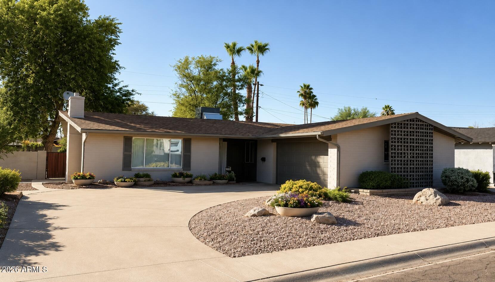 Live in the center of it all with this single-level Scottsdale rental just minutes from Old Town. Tucked into a character filled neighborhood with no HOA, this 3-bedroom, 2-bath home offers the perfect mix of style, comfort, and location. Step inside to a light-filled interior with a clean, open feel and a statement brick fireplace that adds just the right amount of edge. The layout is both functional and inviting, designed for easy everyday living with a modern touch. Outside, the private backyard is all about low-maintenance living, giving you more time to enjoy everything Scottsdale has to offer. A 2 car garage, extended driveway, and extra storage add to the home's convenience. From morning coffee runs to nights out in Old Town, you're just minutes from some of Scottsdale's best restaurants, shopping, and entertainment, plus quick access to Loop 101 for an easy commute. If you're looking for a rental that delivers on both vibe and location, this one checks all the boxes.