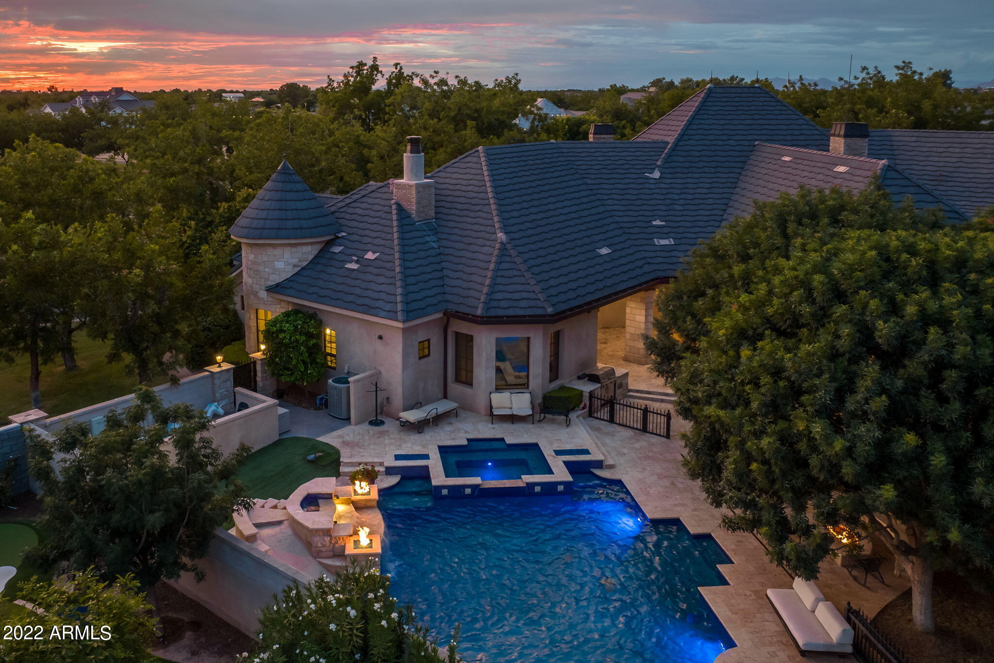 Come be a part of one of the most prestigious and unique communities in the Southeast Valley. This home was built by a builder/developer who spared no expense on every aspect of this home to make it their own. Prominently situated on a large corner lot that you will have to walk around on both streets to capture all the exterior detail. The Pecans are famous for their trees and grass, and you will find plenty of shade and cool grass on this property. Inside you will find 4 bedrooms, 2 of which make up a dual master, located on each end of the home. One end can be closed off as a separate attached casita with its own garage entrance. The office, game room and great room are exquisite with ample space for the most demanding designer. The patio and pool are straight out of a 5 star resort.