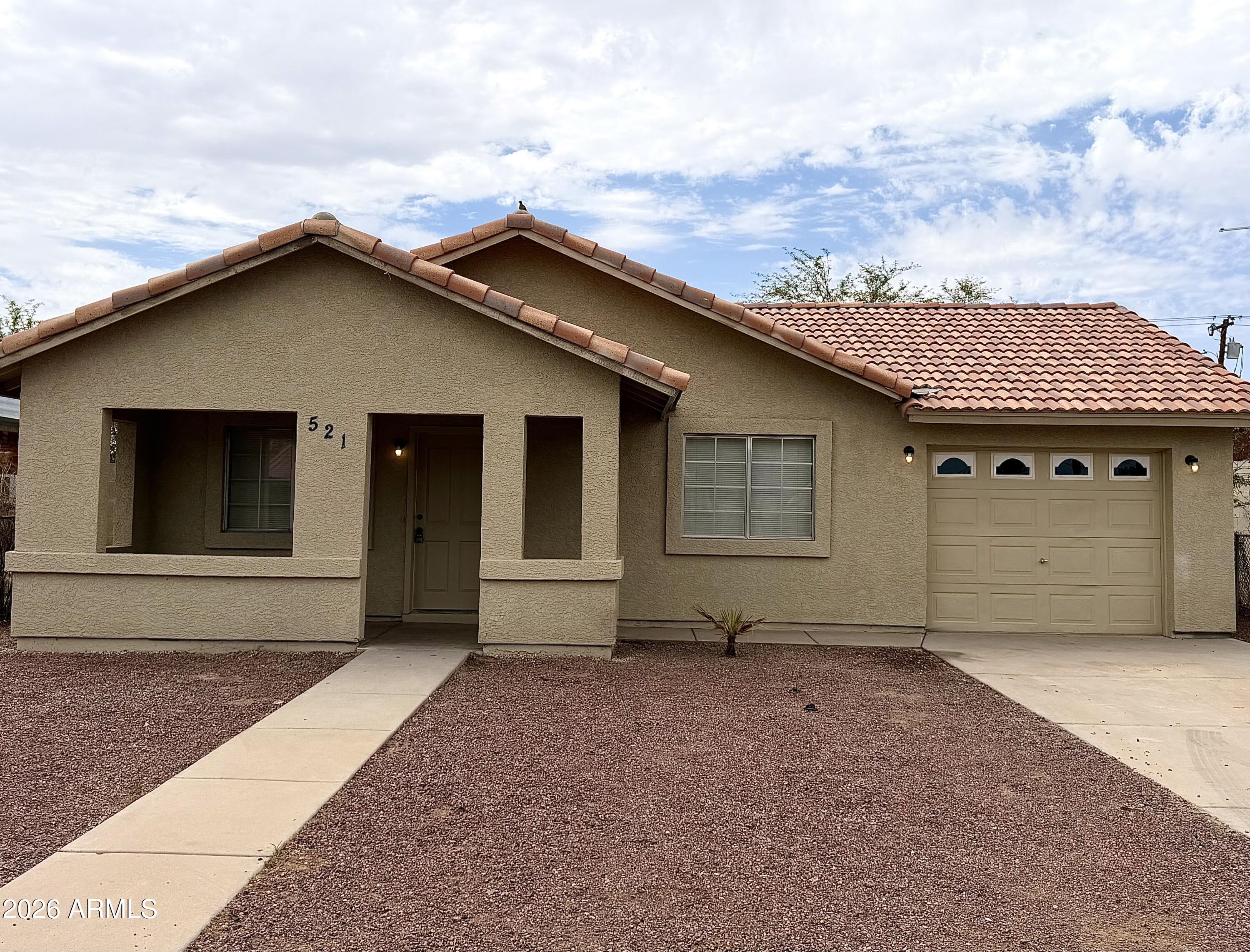 Fantastic investment opportunity or perfect move-in ready starter home in Casa Grande! This charming property boasts fresh interior and exterior paint. Having served as a highly consistent, income-producing rental for years, it is ready for a savvy investor to add to their portfolio or a primary buyer to make it their own. Clean, refreshed, and complete with a convenient RV gate and plenty of potential--don't miss out on this turnkey gem