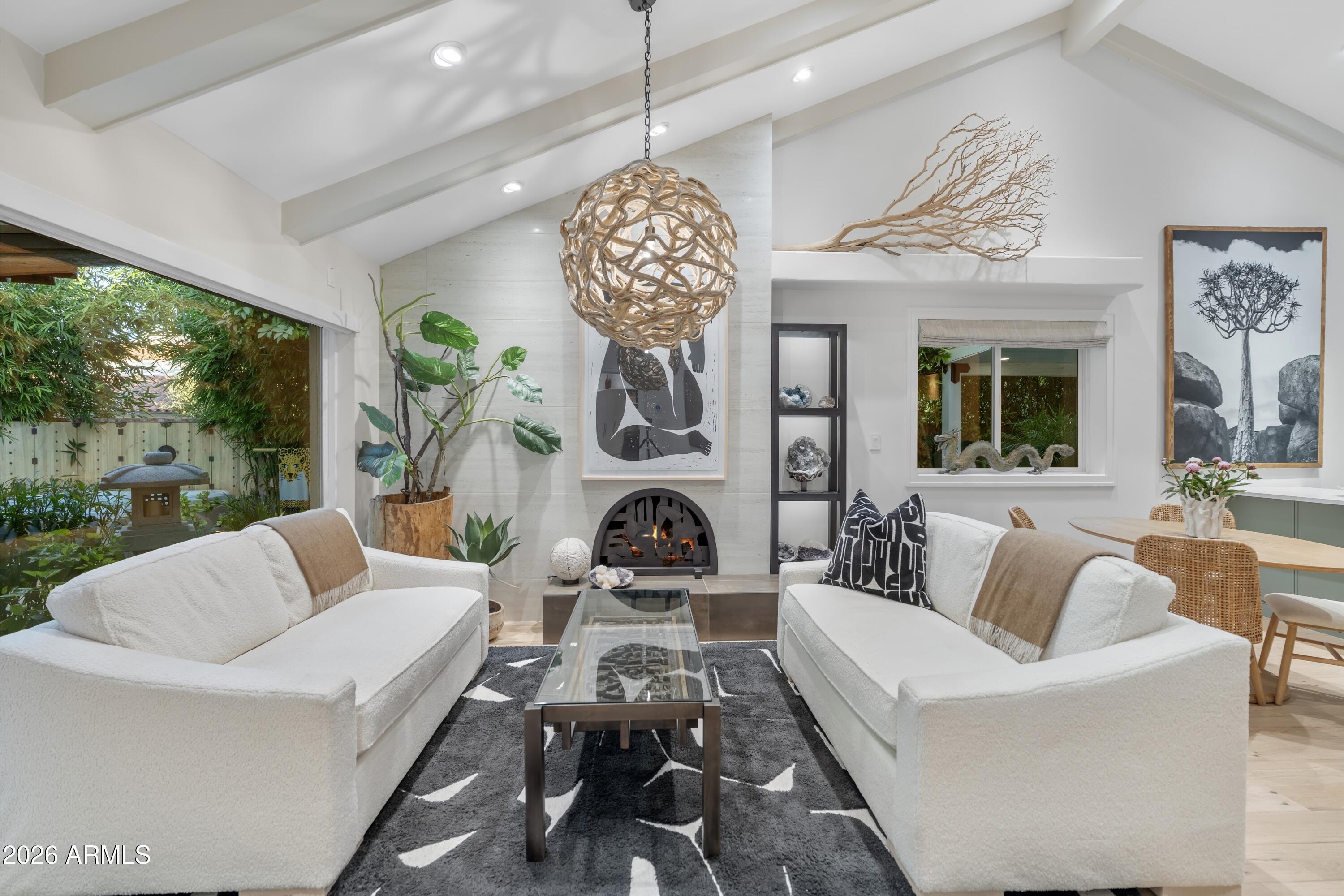 Architect David Wimmer prior residence, further curated by Modern Home design team, allowing natural light and open spaces throughout this jewel box. A private, lush paradise in the sought-after Resort Corridor, this beautifully remodeled 2 BR/2BATH corner-unit home has been artfully reimagined from the inside out. Custom steel work, cabinetry and window coverings define the interior, along with Fisher & Paykel appliances and a bright, open floor plan. The recently expanded outdoor space is truly one of a kind with a built-in hot tub, Japanese pa-goda, tropical landscaping and fully automated waterfall pond encircling a one-ton stone Buddha head by Kona Landscaping. The community area has a large pool, gym, and a newly remodeled courtyard and two-story designer clubhouse. Upscale... amenities, an ideal location and the utmost in privacy, this is the perfect home for those seeking luxury, security, and convenience. The ultimate in turnkey, resort-style living; and easy to preview!!