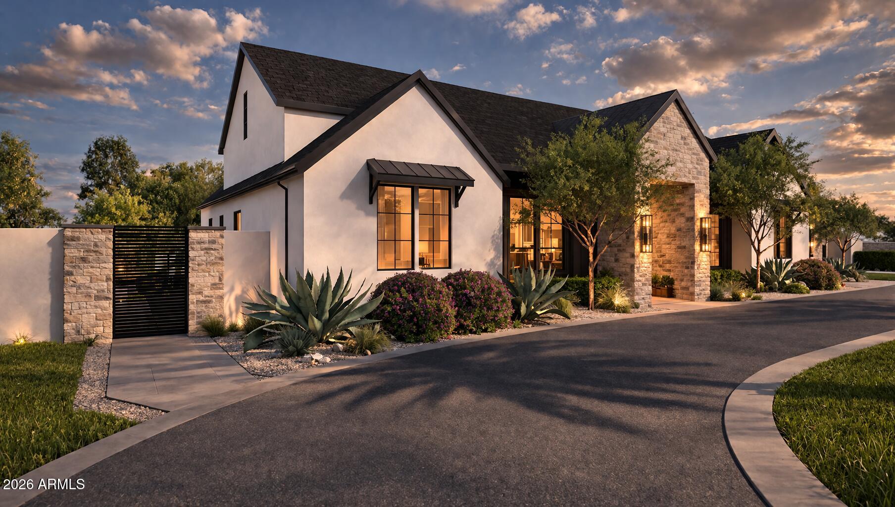 The Mews Residence at 19730 E Mews Rd is a ground-up custom estate crafted by New Look Development and designed by Karnafel Designs, a masterclass in modern farmhouse luxury on a private, walled-and-gated 1.14-acre lot (49,920 SF) in Queen Creek. No HOA. 

Estimated completion end of June. At 6,961 square feet of living space with 5 bedrooms, 5 full bathrooms, and 2 powder rooms, every detail has been executed at the highest level. The exterior sets the tone immediately, white stucco and dark board-and-batten siding are anchored by natural stone columns and a dramatic arched stone entryway, framed by desert-adapted landscaping and a sweeping circular drive. Step through the foyer and the great room commands attention, with soaring 16-foot vaulted ceilings clad in warm wood, a signature iron chandelier, built-in shelving, and a gas fireplace with raised stone hearth. A 16-foot quad-slider glass wall dissolves the boundary between indoors and out, opening to 742 square feet of covered outdoor living beneath a vaulted tongue-and-groove ceiling with exposed beams, a built-in gas BBQ, wet bar, and an outdoor-rated gas fireplace. 

The chef's kitchen is built to perform, 48-inch propane range with hood, 60-inch refrigerator with water, marble slab backsplash, oversized island with seating, walk-in pantry with triple-slider access to the outdoor living area, and a coffered ceiling over the dining space anchored by double awning windows flooding the room with natural light. The main-level primary suite features 12-inch tray ceilings, double pocket door entry from the spa-caliber bath, a curbless tile shower, freestanding soaking tub, and dual walk-in closets. Three additional bedrooms on the main level offer en-suite or shared bath access. A dedicated study with 10-foot double hinged glass panel doors, a wine cellar, media room, mud room with lockers, laundry, and two powder rooms complete the first floor. The second floor delivers a fifth bedroom, an expansive game room, a private office, and a balcony accessed through a 12-foot triple-slider glass wall, all under vaulted ceilings.

The 1,828-square-foot indoor sports complex is unlike anything in Queen Creek. Fully insulated and climate-controlled by a dedicated 5-ton HVAC system, it operates at the same standard as the main living space year-round. The space is purpose-built to host a golf simulator, basketball, and pickleball, and with dual 14x14 overhead doors, 16-foot ceilings, and roundabout access, it doubles as an RV-capable garage when needed. The 3-car garage features Avante glass panel doors and 800-amp electrical service,  more than sufficient for EV charging, welding, or any high-draw application. Out back, a resort-caliber pool with a natural stone waterfall and a dedicated 145 SF pool bath with sauna access complete the outdoor experience. A 118 SF vault provides secure storage. All of this on nearly 1.15 acres with full perimeter walls, gated entry, and absolutely no HOA. 

This is Queen Creek's next landmark property.