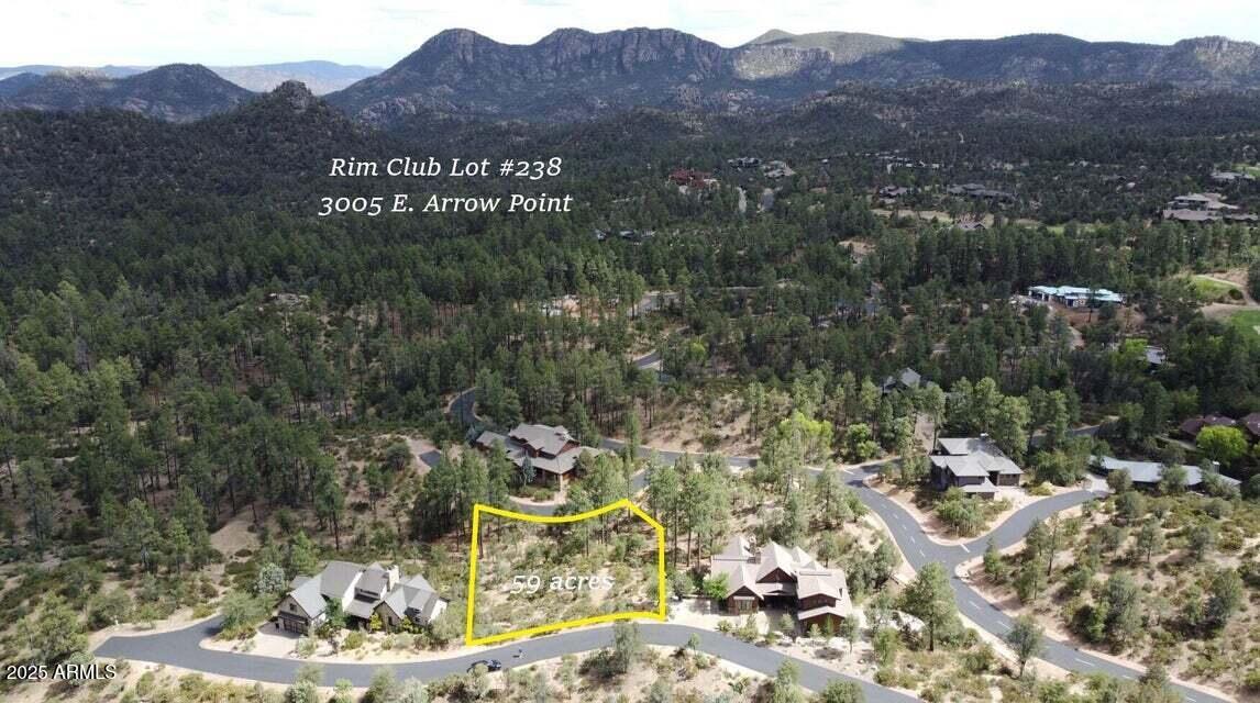 Positioned above the pines on .59 acres, this view lot surveys Monument Peak, the Stewart Mountains, and an expanse of Tonto National Forest, a backdrop that changes with every season. The site is nicely wooded with a favorable slope, inviting architecture that steps lightly with the land and frames wide, southeast-leaning panoramas.
This is a build-to-suit opportunity: collaborate with Integra to refine orientation and a modern mountain plan. As an added benefit, the seller will credit $7,500 toward the Sports Membership initiation fee at close of escrow.
We'll review early budgets so you can move forward with confidence. Seller will carry the financing