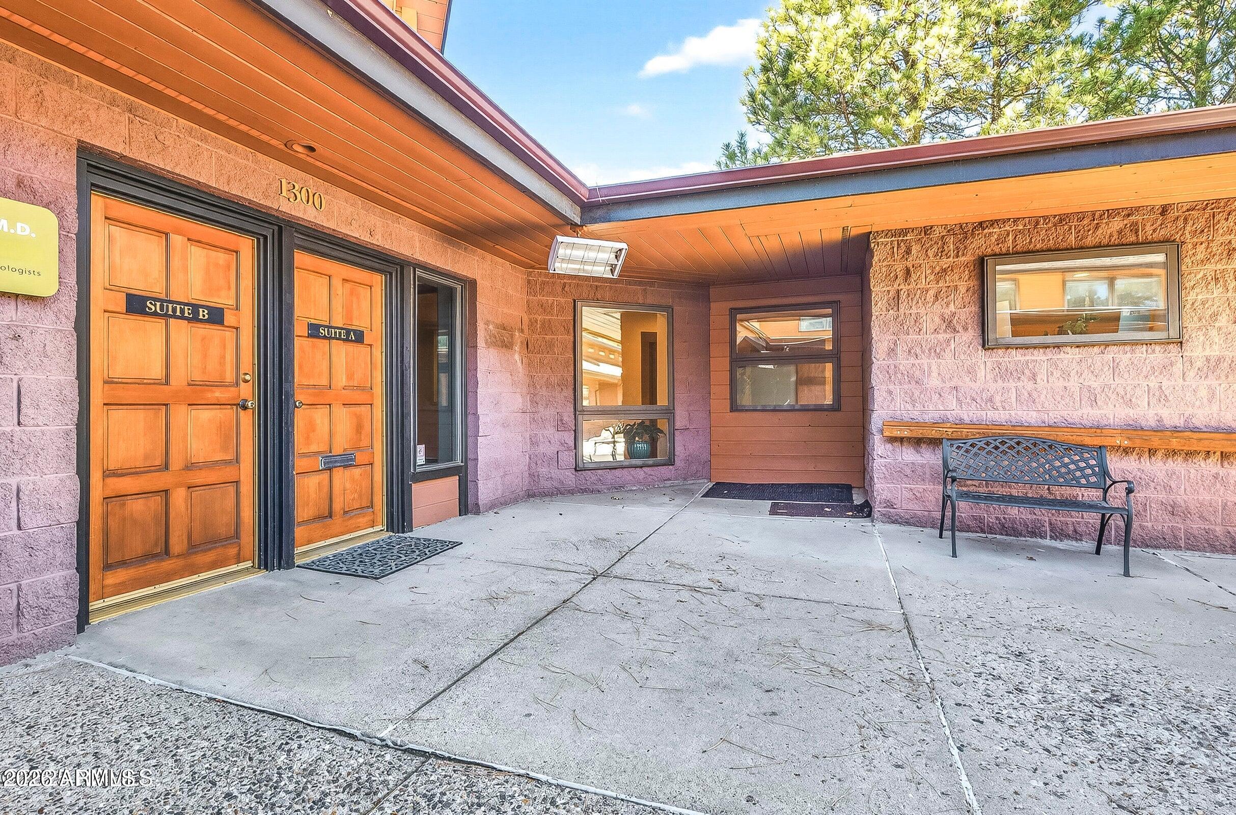 This impressive professional space creates a strong first impression in an ideal location, with convenient access to Flagstaff Medical Center. A dedicated walking path connects the leased suite directly to Flagstaff Medical Center. The space has been fully remodeled and thoughtfully designed for medical or wellness use, offering a light, bright, and inviting environment. In addition to 5 offices and two bathrooms, there is a shared entry, waiting room, and storage with the medical office next door. Buyer to verify the square footage to their satisfaction.