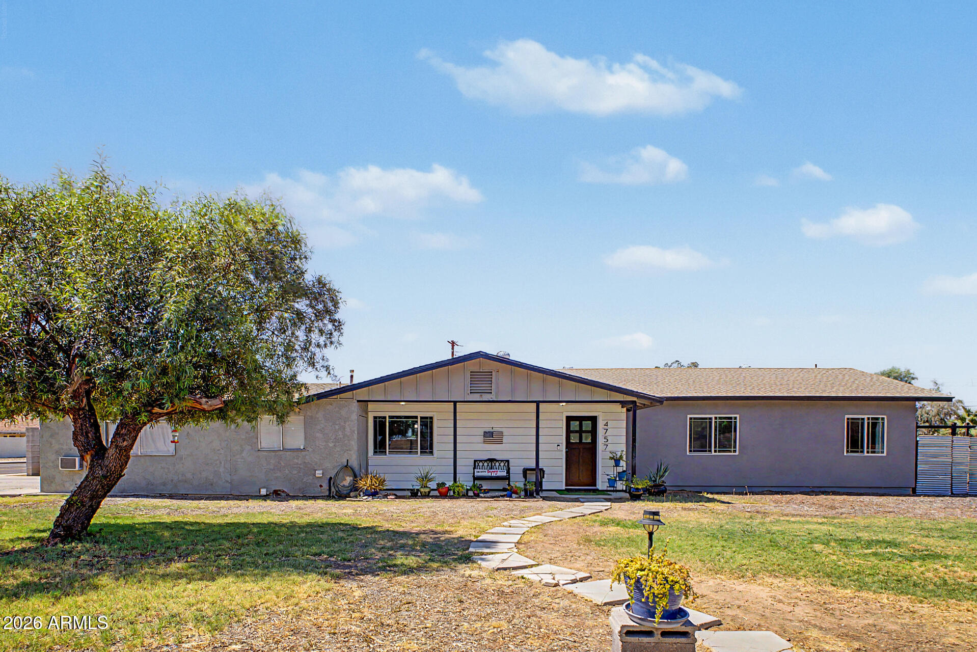 Situated on a spacious corner lot of over 1/3 acre in a desirable non-HOA community, this 2,020 sq. ft. home offers 4 bedrooms and 2 bathrooms with room to spread out both inside and out. A semi-recent addition expands the home with a large great room, dedicated office, and generous laundry room, all featuring 9+ foot ceilings for an open, airy feel. Fresh interior paint gives the home a clean, updated look, while mini-split systems in every room provide individualized climate control and year-round comfort. The kitchen features a new microwave, stove, and dishwasher. Outside, enjoy a chicken coop, oversized yard, and plenty of space for gardening, entertaining, or future projects. Complete with a 2-car garage, this property offers freedom, functionality, and no HOA restrictions.