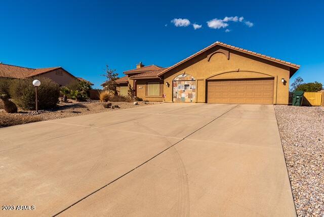 Home Sweet Home . Welcome to this beautiful 4-bedroom + bonus room ,2 bath home in highly desirable subdivision of Canyon De Flores .Pride of ownership surrounds this neighborhood without expense of HOA. This home is in pristine condition and has been meticulously cared for. If the curb appeal has you intrigued, wait until you step inside. From real wood cabinetry throughout the home to stone fireplace and pillars, you wont want to miss the chance to make this home yours. The kitchen is a cooks delight with ample storage and a nice size island. The back yard is almost a half acre with a covered pergola outside BBQ/ kitchen space and nice; grass 39'x39' area. There is an attached small 3rd garage and workshop with industrial shelving. The 5th room is a bonus/studio, great for home gym!