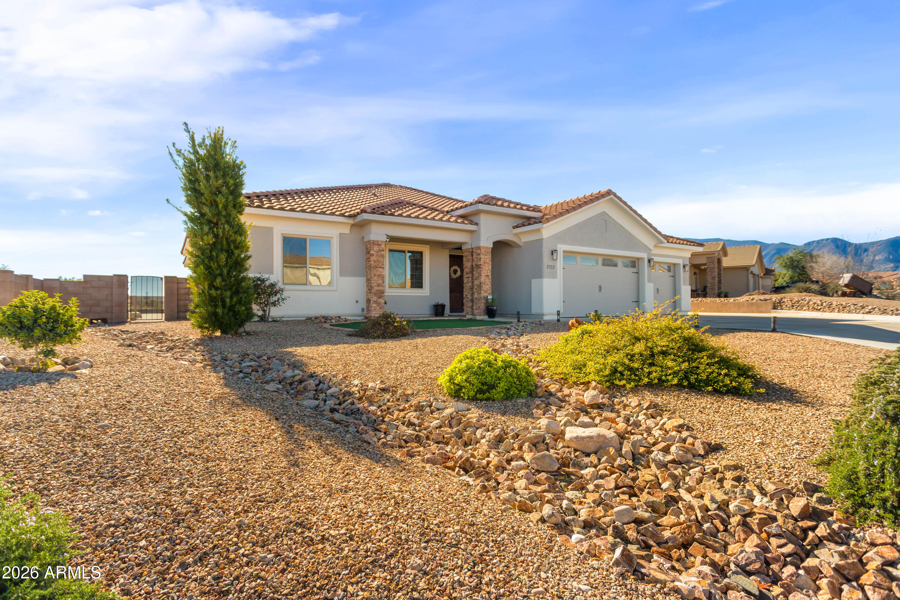 Welcome home to the desirable La Terraza subdivision. Come into this gated community and arrive to this beautiful 4 bed 3 bath home backing up to wide open spaces with views to die for. Enjoy your solar heated pebble tec pool with custom waterfall that lines up with our very own water fall in Carr Canyon. Relax on the spacious back patio and enjoy the views. Inside you will find luxury throughout this open concept floorplan. This move in ready home is ready for its next owner.