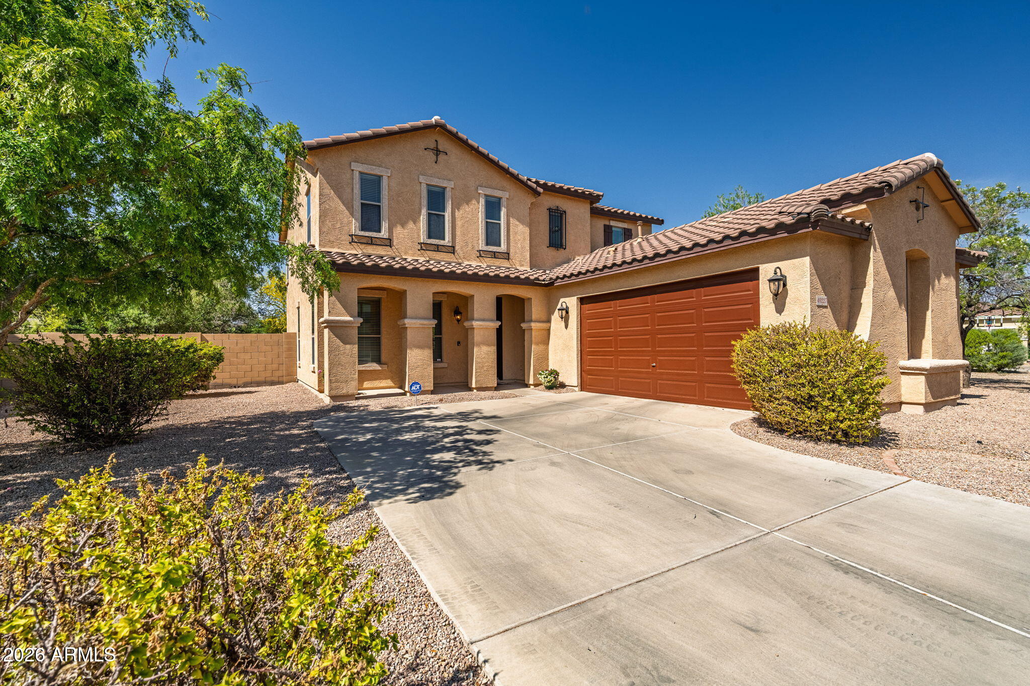 This 2,700 sq. ft. home has 4 bedrooms 2 1/2 baths plus loft and is situated on a 1/4-acre lot. Recently undergoing a remodel, this residence offers a flawless modern living experience. Step inside to discover a bright, freshly painted interior complemented by gorgeous 7-inch wide-LVP flooring that flows continuously throughout the entire downstairs without a single transition. Striking new 4 1/2-inch Craftsman-style baseboards and crisp new trim add the perfect touch of sophisticated elegance to every room. Natural light streams seamlessly through the expansive layout, highlighted by 9-foot ceilings. The heart of the home features a remarkably large kitchen boasting 42-inch cabinets, a reverse osmosis system, and space perfect for baking and hosting family gatherings. Also downstairs is a guest room and oversized laundry room with cabinets - washer & dryer included! Morning sunrises beautifully illuminate the front porch, offering a peaceful start to your day.
The backyard is surrounded by mature trees and an abundance of flowering vegetation, providing a private, natural setting for outdoor exploration and bird watching.
Move in with peace of mind with a PAID ONE YEAR HOME WARRANTY provided by the seller.

The desirable Desert Passage community completes the package with access to a sparkling pool, sports fields, tot lots, miles of scenic walking paths and nearby college and A Rated schools.