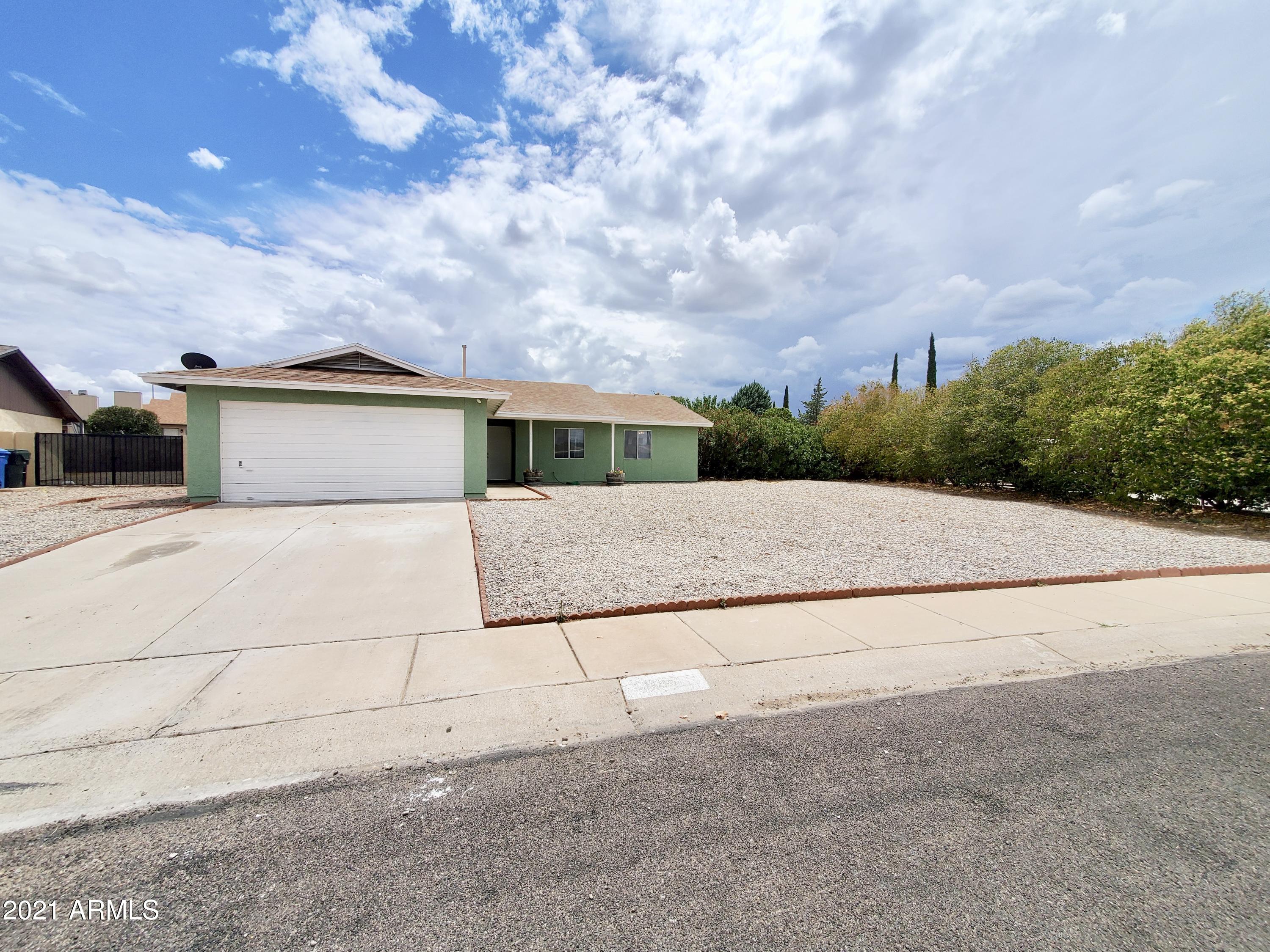 3 bedroom, 2 bathroom home with a 2 car garage on a large lot!  Freshly painted exterior, dog run, private backyard, lots of room to do whatever you wish with your large lot.  The HVAC system will keep you nice and cool inside. Kitchen has large pantry, two living areas, tile throughout home with carpet only in bedrooms, and covered patios.  Lots to love in this one!