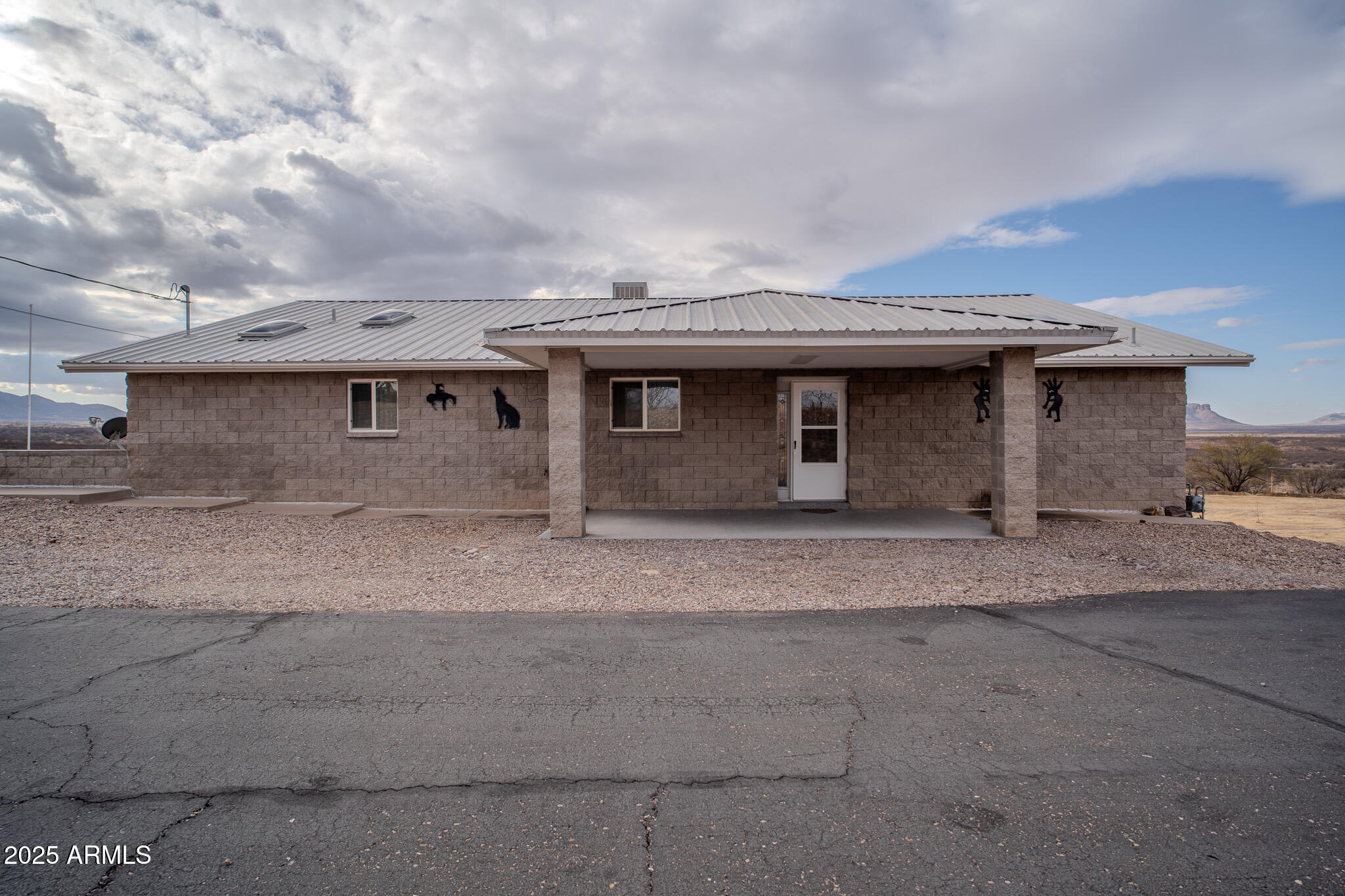 Do not miss out on this incredible house! 2 bedroom and 2 bath house has a fully heated and cooled Arizona room upstairs and fully heated and cooled workshop downstairs! Plenty of room to additional bedrooms! Oversized garage and a 5 bay carport under the balcony offers plenty of space for any car enthusiast! RV parking with hook-ups is great for company. You will be amazed by the breathtaking views from your covered balcony! This home has been meticulously well maintained by just ONE OWNER! In the heart of Huachuca City you are only minutes from shopping in Sierra Vista.