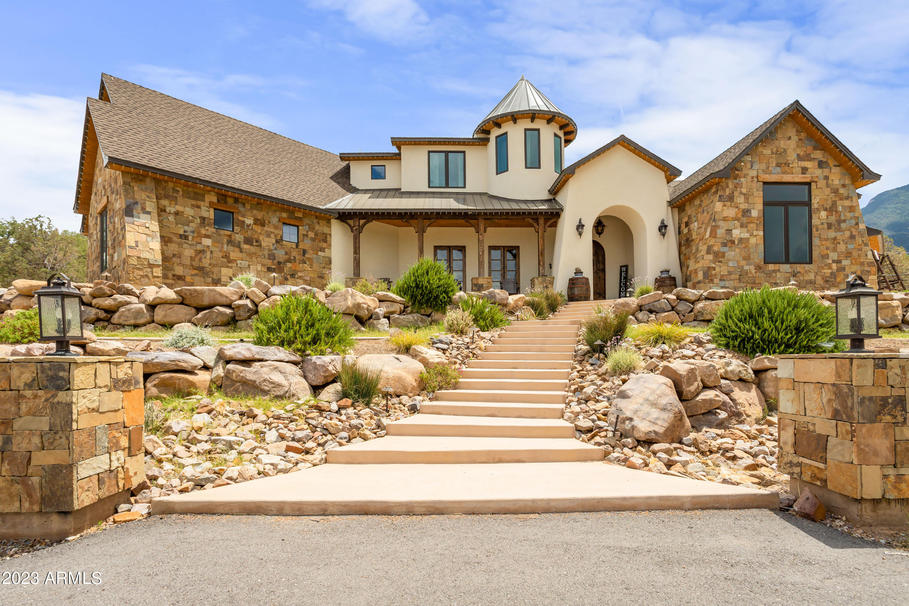 Experience unparalleled luxury living at this custom-built masterpiece in Ramsey Canyon. This 5-bed, 4-bath gem spans 4.9 acres, boasting 4,315 sq ft of exquisite craftsmanship. Built in 2019, no detail has been spared, from the custom turret offering panoramic views to the open floor plan designed for both intimate gatherings and grand entertaining. The gourmet kitchen features top-of-the-line appliances, while the elegant dining area sets the stage for unforgettable meals. The master suite is a private oasis, and the remaining bedrooms are spacious and beautifully appointed. This is your chance to create your dream retreat. Located at the base of Ramsey Canyon, immerse yourself in nature's wonders with hiking trails and breathtaking wildlife. Don't miss out on this remarkable property.