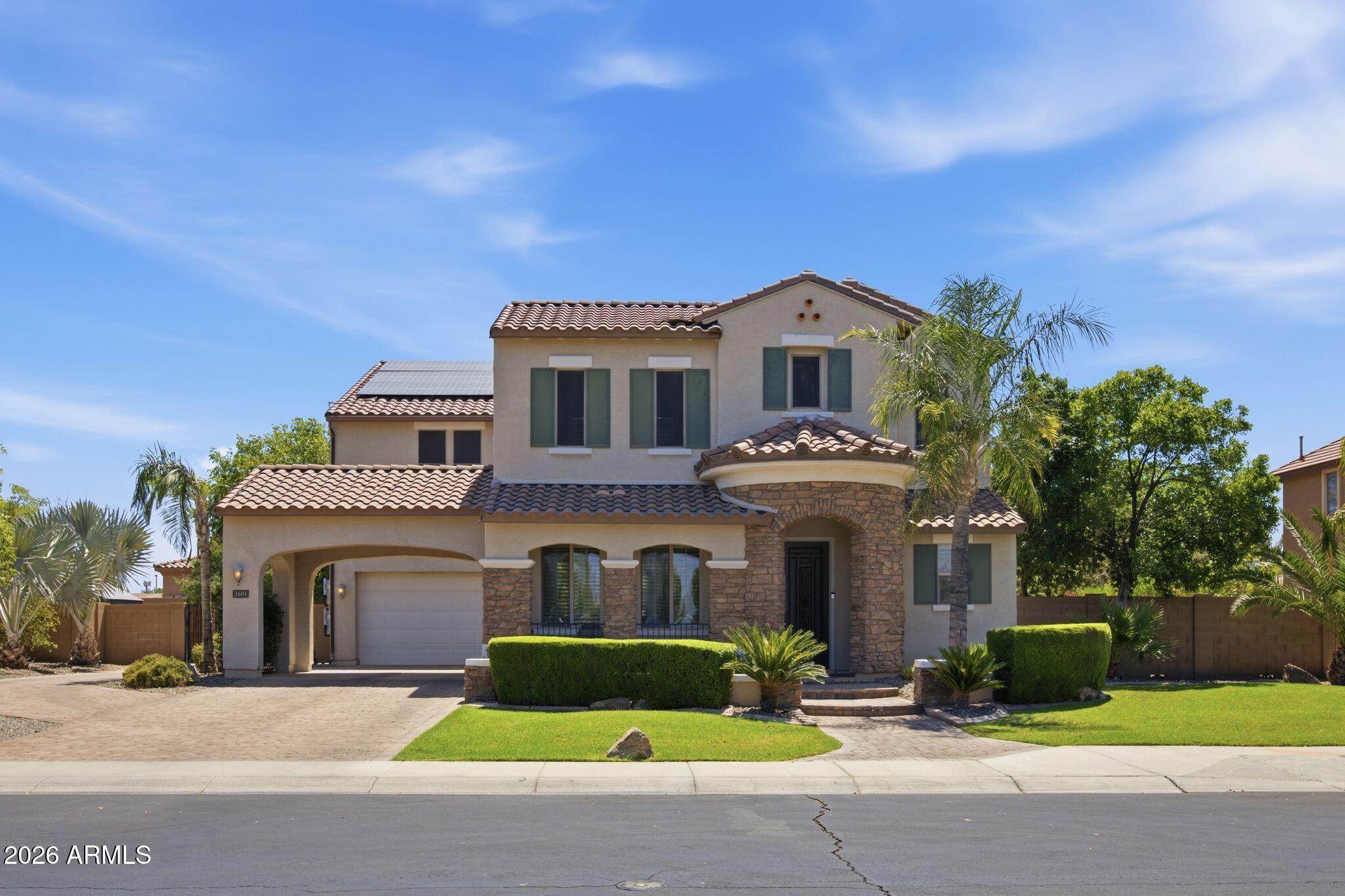 Welcome to your dream home in one of Gilbert's most desirable locations! Situated on an oversized lot, this spacious home features 6 bedrooms, 4.5 bathrooms, dual staircases, a loft, a dedicated movie theater with surround sound, and a secondary primary suite, making it perfect for multi-generational living. The backyard is designed for entertaining with a sparkling pool, hot tub, built-in grill, gazebo with seating area, dog run, and RV gate. Permanent exterior lighting adds year-round curb appeal and convenience. Complete with a 3-car tandem garage, extended driveway, owned solar, and a prime location just minutes from shopping, dining, parks, and freeway access, this home offers the space, comfort, and features you've been looking for.