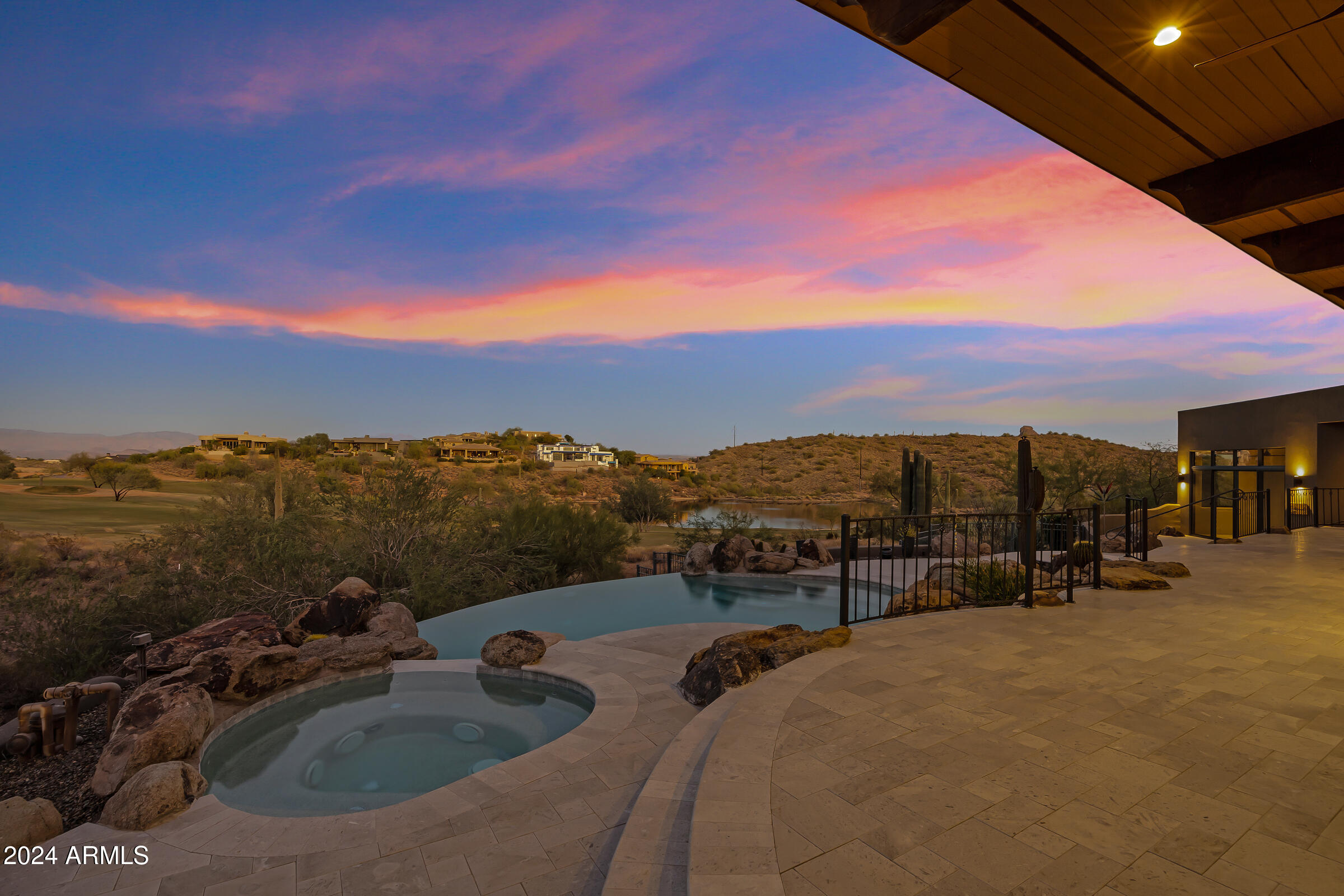 *** SPECTACULAR VIEWS*** of Four Peaks & surrounding mountains, this STUNNING FireRock home is ideally situated looking out over 2 golf course fairways & a LAKE! The ULTIMATE in soft Contemporary living w/a GREAT Room highlighted by 14ft beamed ceilings, a 2-way Stone Fireplace & floor to ceiling windows to enjoy  EXTRAORDINARY VIEWS all around! Main house is approx. 3,851sf PLUS approx. 402sf in a GUEST CASITA.  This den could be a media/theater room!  This  Chef's kitchen boasts Quartz countertops, Custom Designed Cabinetry, & a Wolf induction Cooktop & Oven.  A gorgeous spacious Primary Suite which has dual vanities, a sep. shower & tub & a customized walk-in closet. EPITOME of RESORT STYLE LIVING w/ OUTSTANDING VIEWS, pool,spa & built-in BBQ! Beautiful Porcelain 24" x 48" tile floors have now replaced the carpeted secondary bedrooms and all porcelain 24" x 48" tile floors throughout refinished 6/24. Additionally,
there is an anti-crack membrane to help prevent the porcelain tile
floors cracking or breaking!