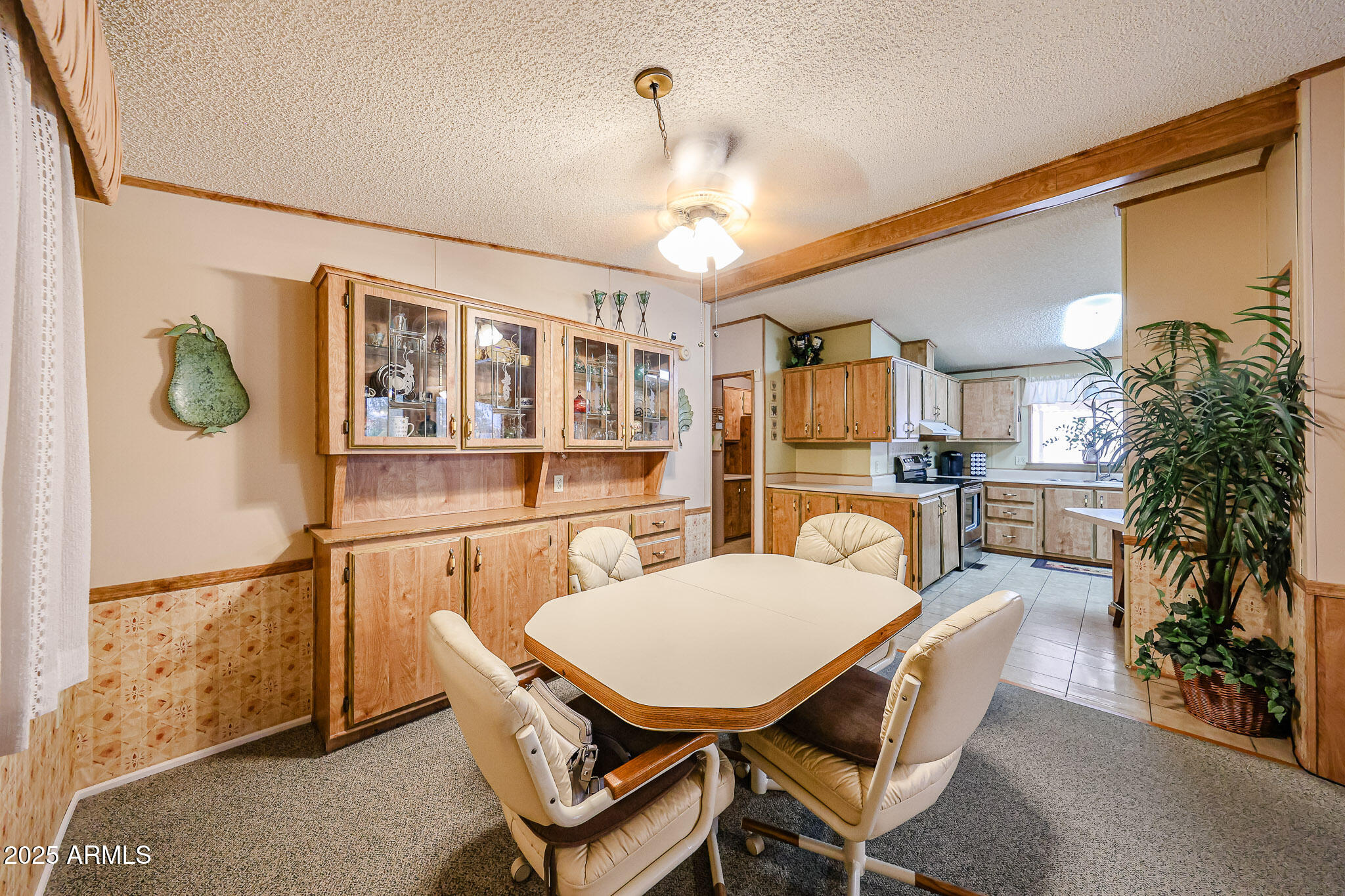 Don't miss this one with large reduction!  So much space!  1560 SF at this price in a high demand 55+ community.  Only a 3 year old roof and 4 year old A/C so you can concentrate on the fun things!  2 bedrooms & 2 baths with W/D  & refrigerator included.  TV stays in living room.  Great trees out front to provide shade.  Room in back to enclose yard. Has storage shed! Ready for your touches.  This 55+ community has a land lease for $935/month that includes water trash and sewer. They have a 24/7 manned guard gate, a 9 hole executive golf course owners play for free, a heated pool, pickleball courts and a rec center with activity calendar. The location in Desert Ridge is hard to beat!  shopping, Mayo Clinic, the 101 freeway close by.  2 dog limit 30lbs. No rentals here. Great lock and leav