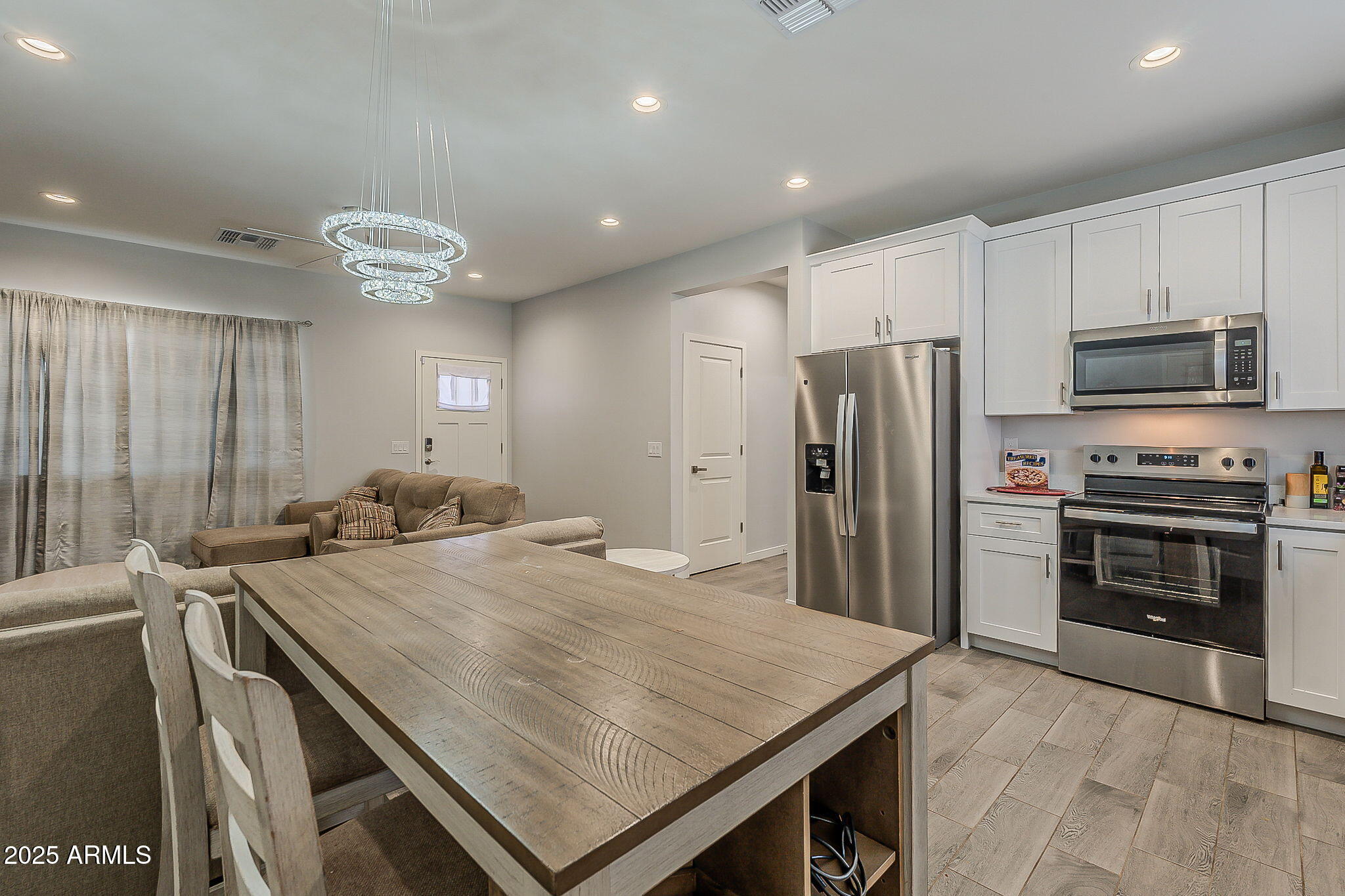Practically new and built in 2024, this rare NO-HOA home combines affordability, comfort, and an ideal location halfway between Phoenix and Tucson! Bring your RVs, toys, and hobbies—there's room for it all. Inside, enjoy upgraded tile, plush carpet, and modern lighting. The stylish kitchen features quartz-style counters, raised-panel cabinetry, and sleek hardware. Energy-efficient spray-foam insulation and all-new appliances add everyday comfort and savings. With laundry access off the carport, this home is perfect for first-time buyers, commuters, or investors—discover why it's one worth moving for!
