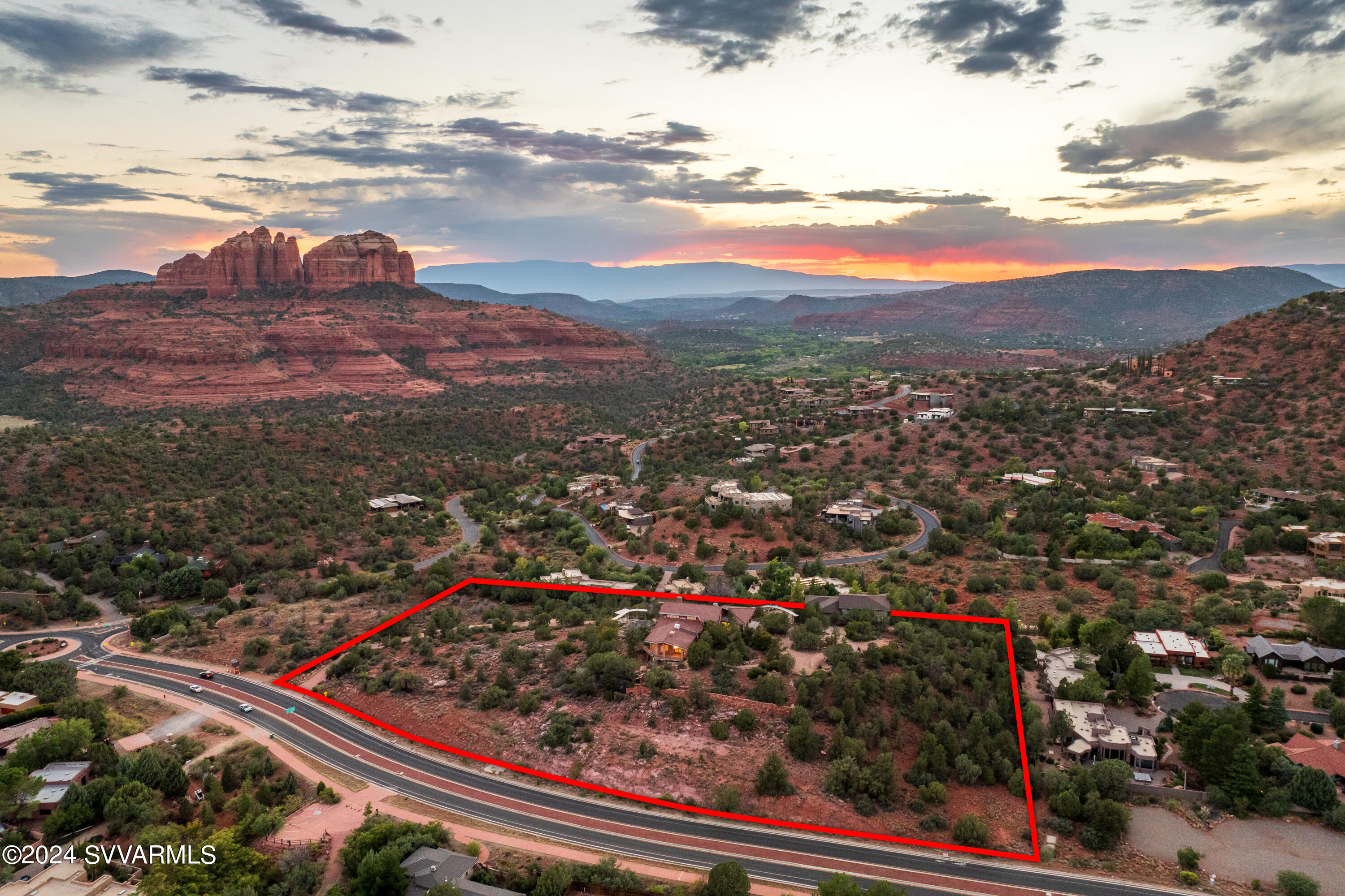 THE HEART OF SEDONA. 2856 State Route 179, an unparalleled estate that offers a once-in-a-lifetime opportunity in one of the most stunning landscapes on the planet. Set against the iconic red rock backdrop, this sprawling property provides panoramic views of nearly every major rock formation in Sedona. The entire property is enclosed, ensuring a sense of absolute privacy and security, while its location, equidistant from both the Village of Oak Creek and Sedona, places you at the epicenter of the area's finest offerings. This exclusive property comes with the freedom of no HOA restrictions, offering endless possibilities for customization and personal expression. Experience the perfect balance of seclusion and connectivity, all within the most majestic natural setting Sedona has to offer.