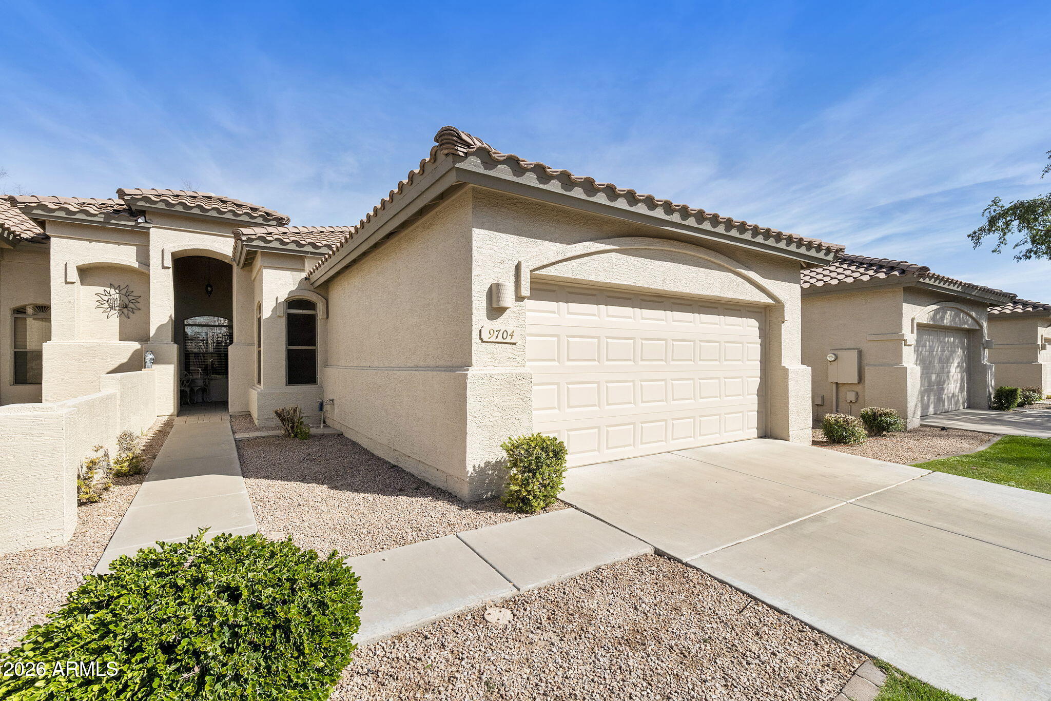 Another great 2BR, 2BA plus den Naples villa in the popular gated active adult community of Oakwood at Sun Lakes. Timeless 20'' tile flooring throughout the main living areas. Great room with vaulted ceilings and amazing light from the many windows with plantation shutters. Kitchen centrally located with Corian cabinets, tile backsplash, lots of cabinets and SS appliances. Primary suite features large walk-in closet, dual sinks and walk-in shower. Split guest bedroom for guest privacy. Den/office with ceramic plank tile floors and double doors. 2017 AC. Modern black cabinets in the garage. North facing patio in private location on the community wall. Enjoy this lock and go villa and the many amenities of this great community with golf, pickleball, tennis, SEE MORE fitness, walking paths, great restaurants, and so many clubs.