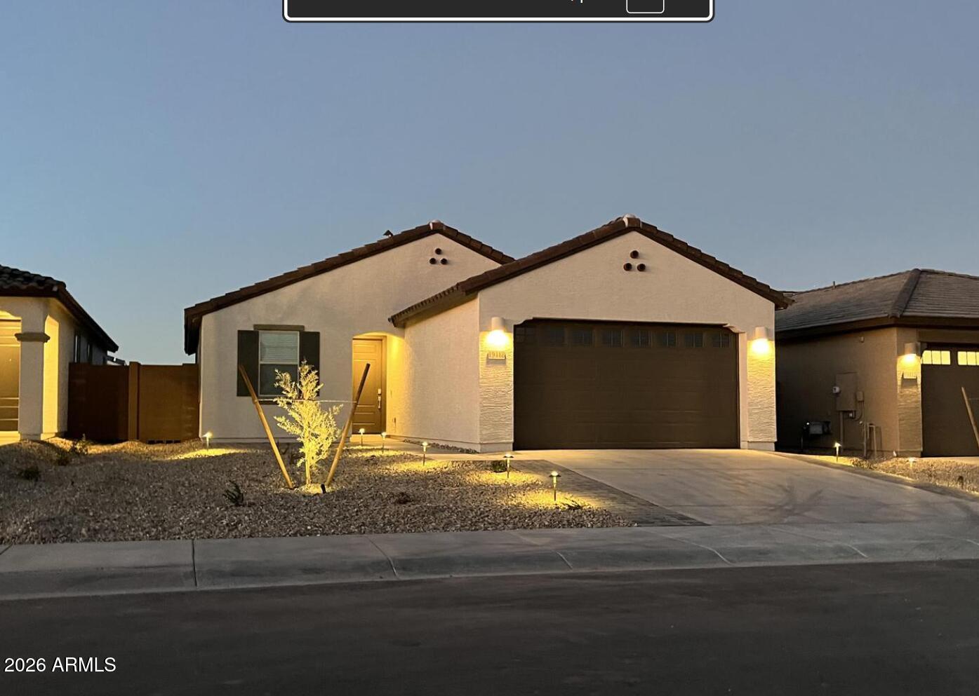 Welcome to this beautifully upgraded 2023 Lennar home located in the desirable Landings community. This move-in ready 3-bedroom, 2-bath residence offers an open-concept floor plan with modern finishes throughout. The kitchen features upgraded cabinetry, granite countertops, designer backsplash, pendant lighting, a large island, gas range, and walk-in pantry. Wood-look plank tile flooring flows throughout the main living areas, complemented by fresh interior paint and abundant natural light. The spacious primary suite includes a spa-inspired bath with an upgraded subway tile walk-in shower, dual vanities, and granite countertops. Additional upgrades include epoxy garage floors, a soft water loop, and low-maintenance landscaping. The backyard is designed for year-round enjoyment extended paver patio, artificial turf, gas stub for grilling, and mountain views. Additional curb appeal includes a paver driveway, covered front porch, and landscape lighting. Conveniently located near Loop 303, shopping, dining, parks, and highly rated schools, this home offers modern comfort in a growing West Valley community.