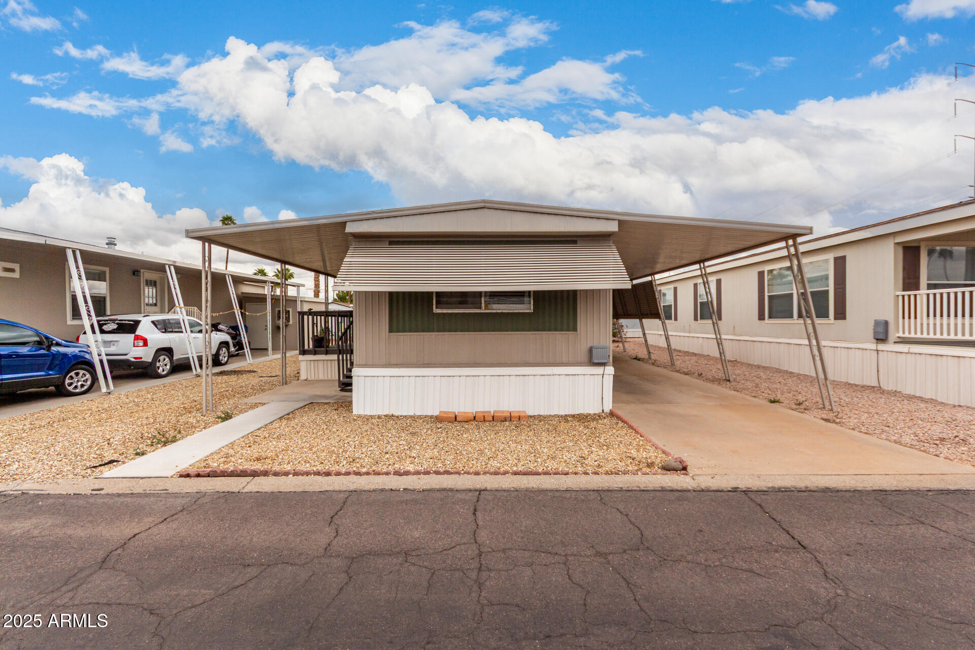 Move-in-ready!!! Nestled in a desirable 55+ gated community, this charming mobile home awaits you! Inside, you'll find a warm neutral palette, wood-look flooring, and a welcoming living room. The kitchen boasts matching appliances, white cabinetry, granite countertops, and a serving window with a breakfast bar perfect for casual dining. Get a good night's sleep in the main bedroom, which features a private bathroom for added privacy. Explore outside and unwind with your favorite drink under the covered patio. Enjoy fantastic community amenities, including a pool, golf course, spa, and more! Don't miss out on this incredible opportunity! Information available on Financing options.