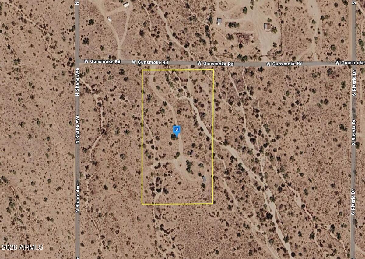 Spacious 4.8-acre parcel in Pima County offering privacy, infrastructure, and stunning mountain views with no HOA restrictions. This fenced and gated property is ready for your vision, featuring a 10x20 concrete pad with a covered metal roof already piped into the septic system. Per the seller, a septic tank has been installed, permitted, and approved by Pima County, along with an approved site plan and hydrologist report --saving you significant time and upfront work. An accessible road off Gunsmoke Road leads directly onto the property, providing ease of access while maintaining a peaceful, rural setting. With breathtaking views of the surrounding mountains and key improvements already in place, this is an excellent opportunity to build your dream home or create a private desert retreat.