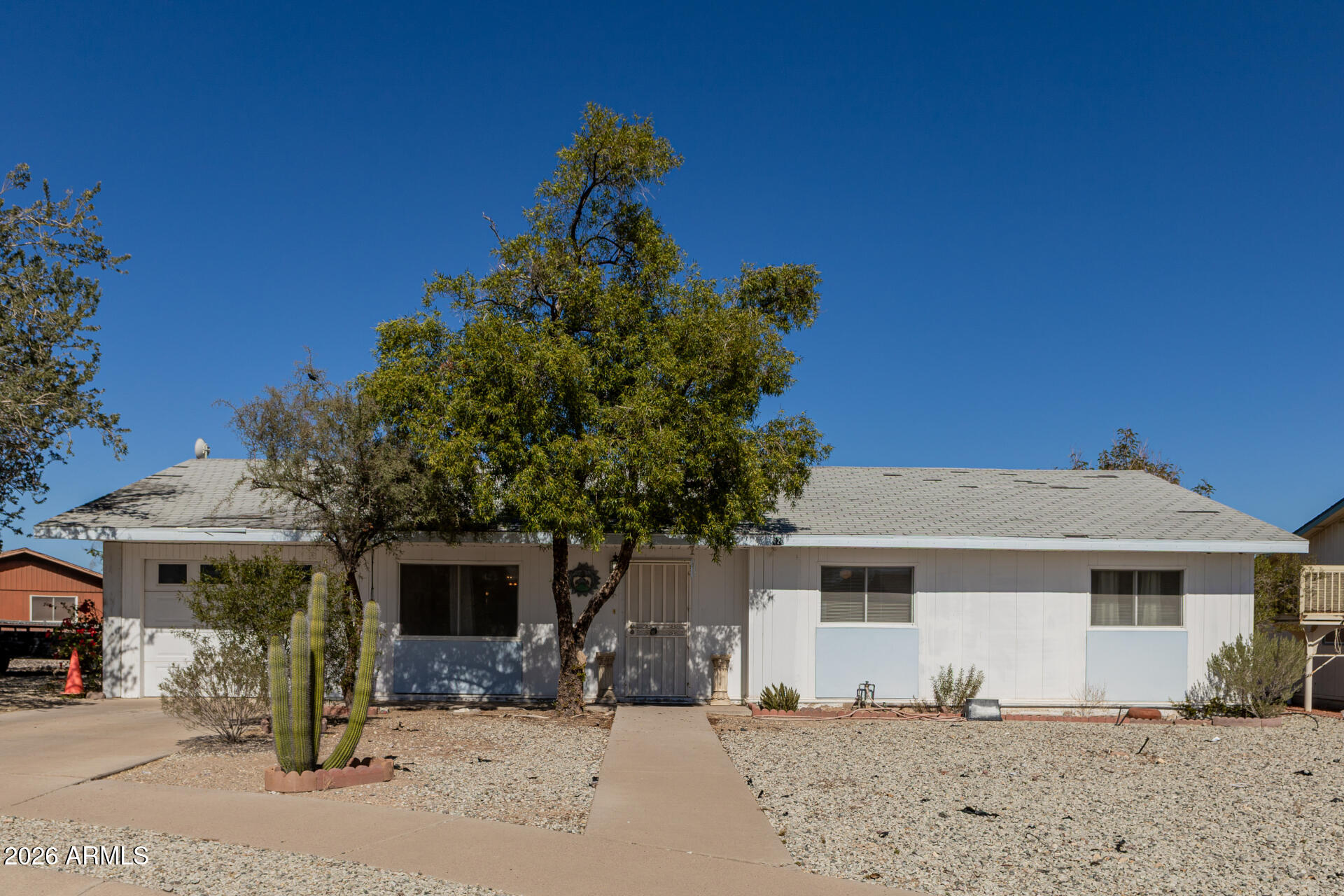 Seize the chance to own this charming 3-bedroom, 2-bath home on a peaceful cul-de-sac! You're welcomed by a cozy living room with wood panel walls and wood-look flooring for a timeless appeal. The well-appointed kitchen comes with flat-panel cabinets, built-in appliances, and a peninsula with a breakfast bar for quick meals. You'll also find a bright sunroom, perfect for enjoying the warm Arizona weather year-round. The main bedroom includes a private bathroom for added comfort. Venture out onto the backyard, offering ample space for crafting your dream outdoor oasis. This value will not disappoint!