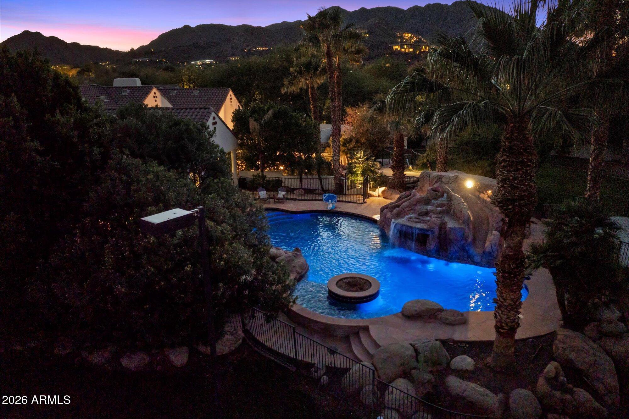 Large grounds, large home, in a great location with views and amenities!  This spectacular estate on nearly 1.7 acres is one of the best values available in Paradise Valley! The Main Residence offers 6 Bedrooms & 7 bathrooms and the Guest House offers 2 Bedrooms & 2 Bathrooms.  This privately gated home with stunning Mummy Mountain and Phoenix Mountain Preserve views, has plenty of amenities. Incredible backyard with koi ponds, waterfalls, large pool, waterslide and 6 Tee-boxes with a practice area. Gorgeous light and bright kitchen with Wolf & Sub Zero appliances, state of the art movie theater, game room, bar, sauna, steam room, gym and 5 Garages! This property is conveniently located within minutes from the new Global Ambassador, world class resorts, shopping, dining and golf.