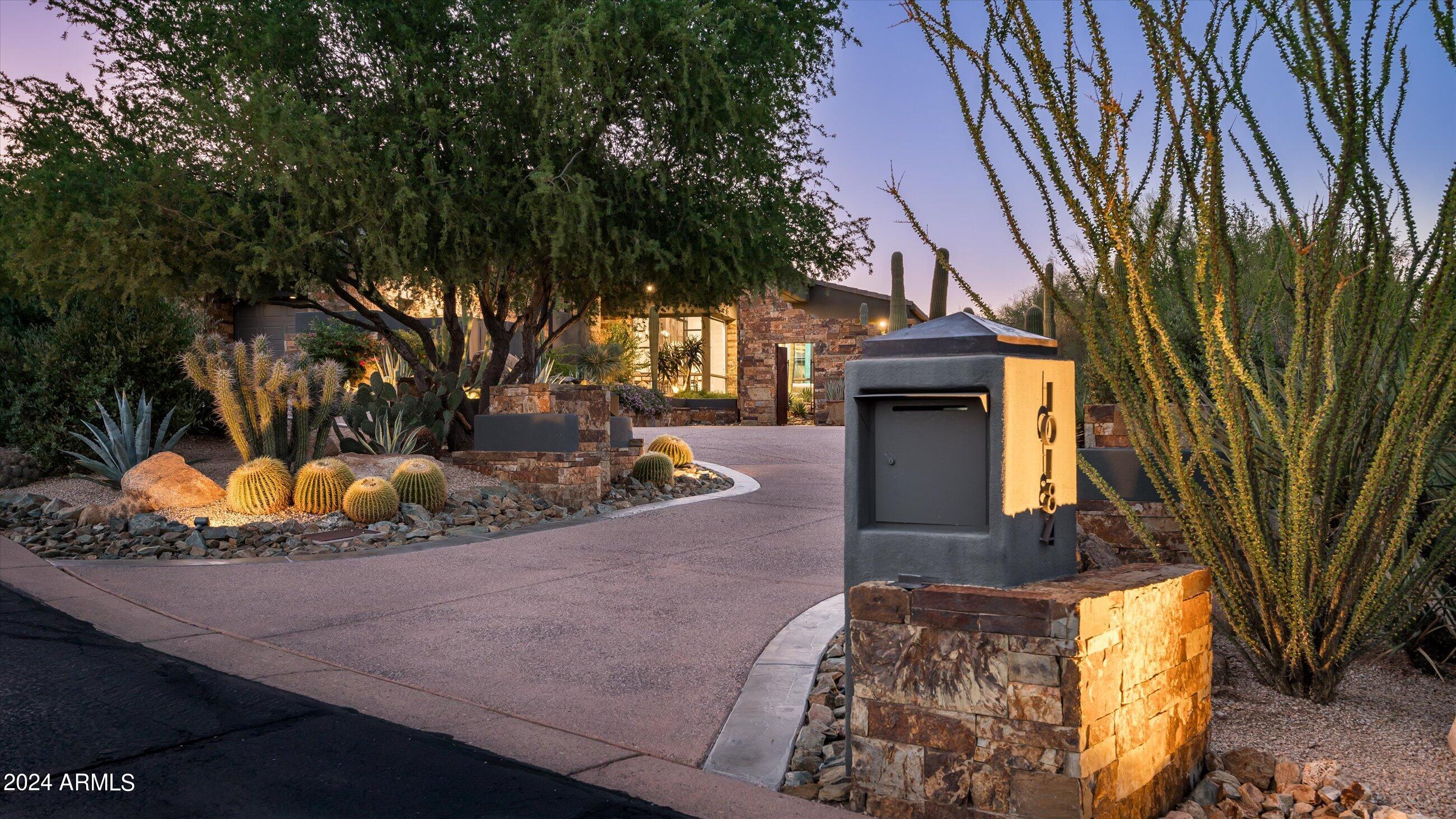 Estancia Golf Membership available * Completely remodeled in 2023 * Elegant residence in the guard-gated community of Estancia with timeless architectural details * The exterior details include an organic composition of dry-stacked stone, stucco and glass with a new concrete tile roof * Sited on an elevated lot with panoramic views of Pinnacle Peak * Split floor plan with a living room, family room that connects to an open kitchen, two guest suites and a dedicated office with full bath providing the flexibility for a fourth bedroom * Interior details include wood plank flooring, granite and quartz countertops, custom-crafted cabinetry, all new custom lighting and dry-stacked stone fireplace surrounds * The resort-style outdoor living space offers a large covered patio, heated pool and spa built-in BBQ station and a gas fireplace *