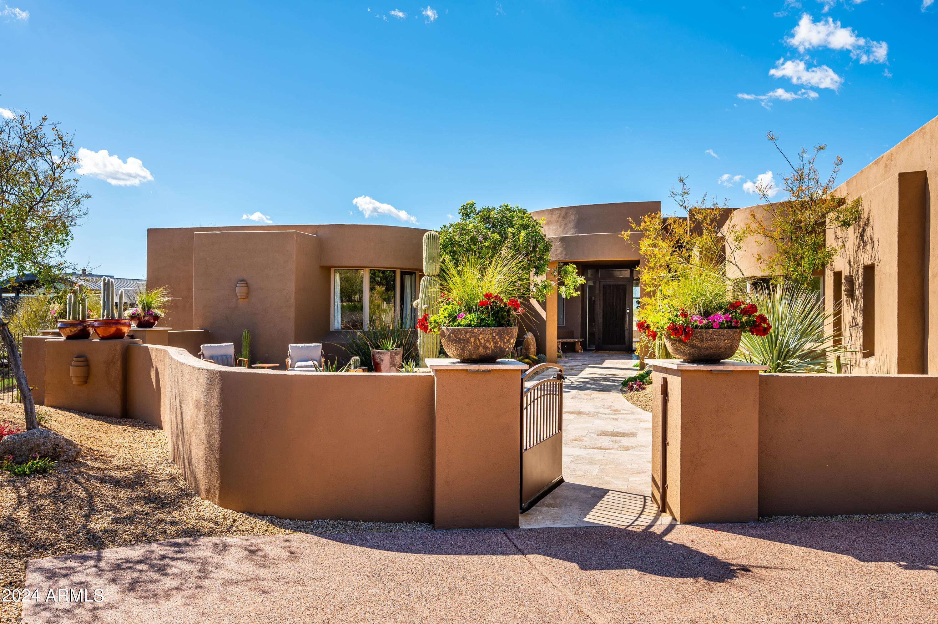 GOLF MEMBERSHIP available with this home! Captivatingly renovated, this contemporary masterpiece resides in the esteemed Desert Mountain community, renowned for its excellence. Nestled within Grey Fox Village, this residence offers unparalleled privacy, situated against a backdrop of serene desert landscapes and breathtaking sunsets that grace the horizon year-round. An exquisite open great room design welcomes you, adorned with a striking floor-to-ceiling expanse of windows that seamlessly merge the allure of natural light and the panoramic desert vistas with the interior ambience. The chef's kitchen is a marvel of modern redesign, inviting culinary exploration and culinary creativity. The master retreat is a sanctuary of sophistication, enhanced by a contemporary fireplace and a sumptuous spa-like bath,offering the epitome of luxury living. Throughout the home, discover the elegance of newly installed wood and porcelain tile floors, elevating every step with grace and style. With three enchanting ensuite bedrooms and baths, plus a fourth bedroom/casita boasting a spacious sitting area and private entrance, this residence offers versatility and comfort for guests or extended family. Outside, a wraparound resort-style patio beckons with its built-in BBQ, inviting pool, and rejuvenating spa, creating an oasis of relaxation and entertainment against the backdrop of the majestic desert landscape. Experience the epitome of desert living in this extraordinary sanctuary of modern luxury.
