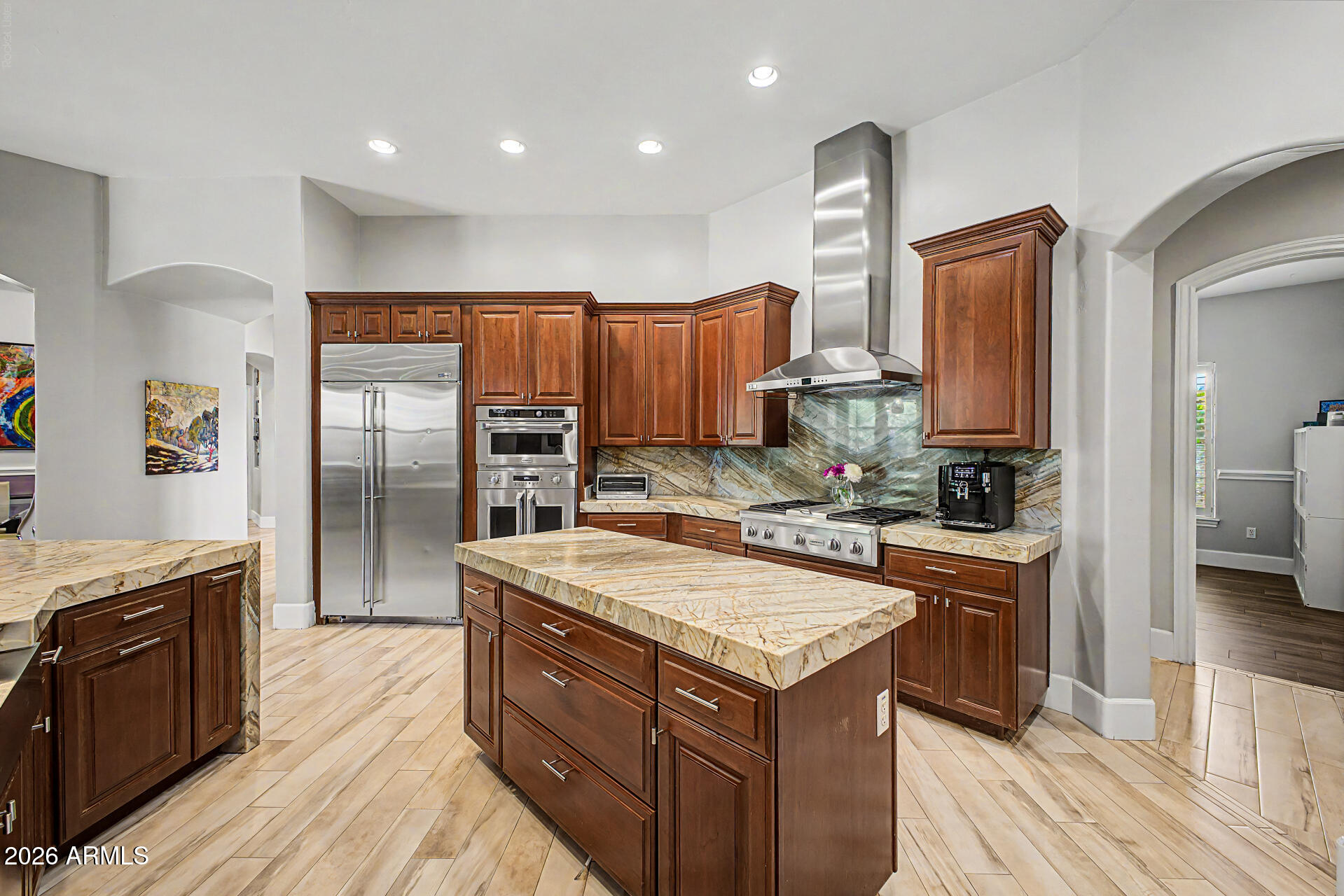 A rare chance to live in North Gilbert's premier gated community, Whitewing at Weihl Estates. This beautifully updated 4 bed with den & large bonus room, 3.5 bath, 3608 sq ft home on a .92 acre irrigated lot offers extended driveway, RV gate, luxury living with a spa style pool, basketball/pickleball court, mature citrus trees, & multiple outdoor seating areas including 2 covered patios; one w/ fireplace. Inside, enjoy a gourmet kitchen with two islands, plus spacious open living areas, a split primary suite w/ two walk in closets & spa-like bathroom offering soaking tub & walk-in shower. Secondary bedrooms feature walk in closets and fully remodeled baths. Major 2025 upgrades include a new roof, owned 17.2 kW solar with two Tesla Powerwalls, Kinetico water system, and tankless heater.