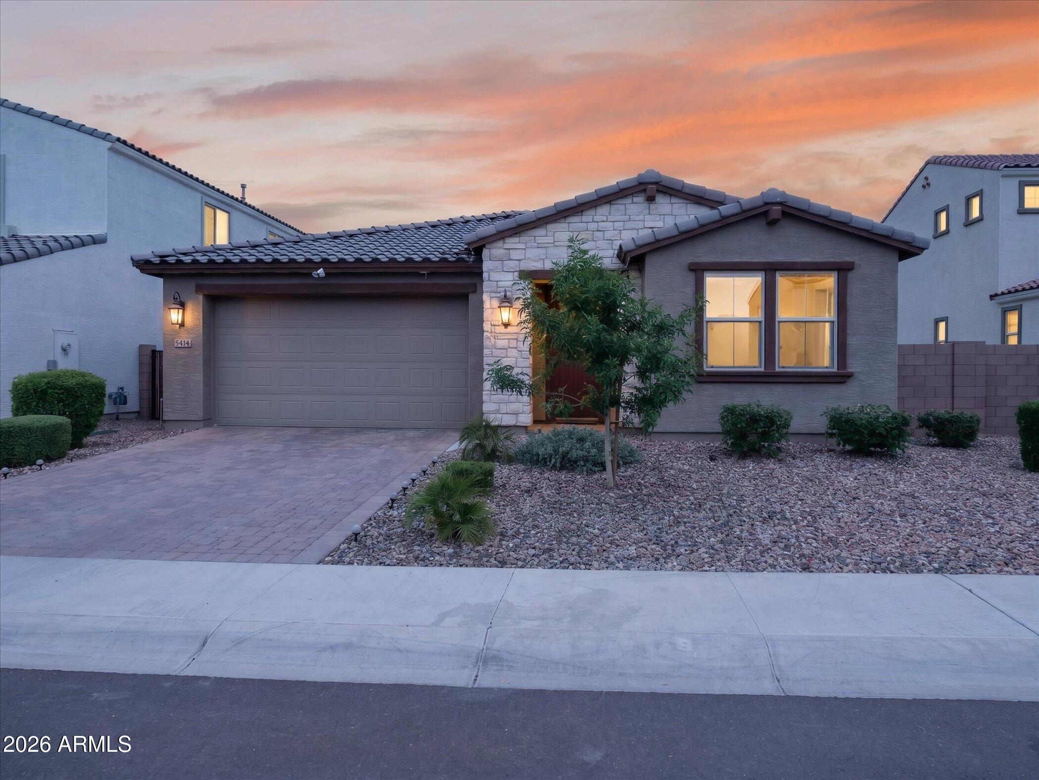 Welcome to this beautifully maintained Hudson floor plan in the desirable Laveen community of Tierra Montana, offering 2,349 sq ft of thoughtfully designed living space. This move-in-ready home features 4 bedrooms, 3 full baths, and an open-concept layout ideal for modern living. Elegant tile flooring flows through the main living areas, while the gourmet kitchen boasts upgraded cabinetry, ample counter space, a large island, and premium finishes. The spacious primary suite includes a well-appointed bath and walk-in closet. Three additional bedrooms and two full baths provide flexibility for guests, family, or a home office. Installed water softener and reverse osmosis system. Enjoy Arizona living with a designed outdoor space. Conveniently located near parks, schools, shopping, dining.